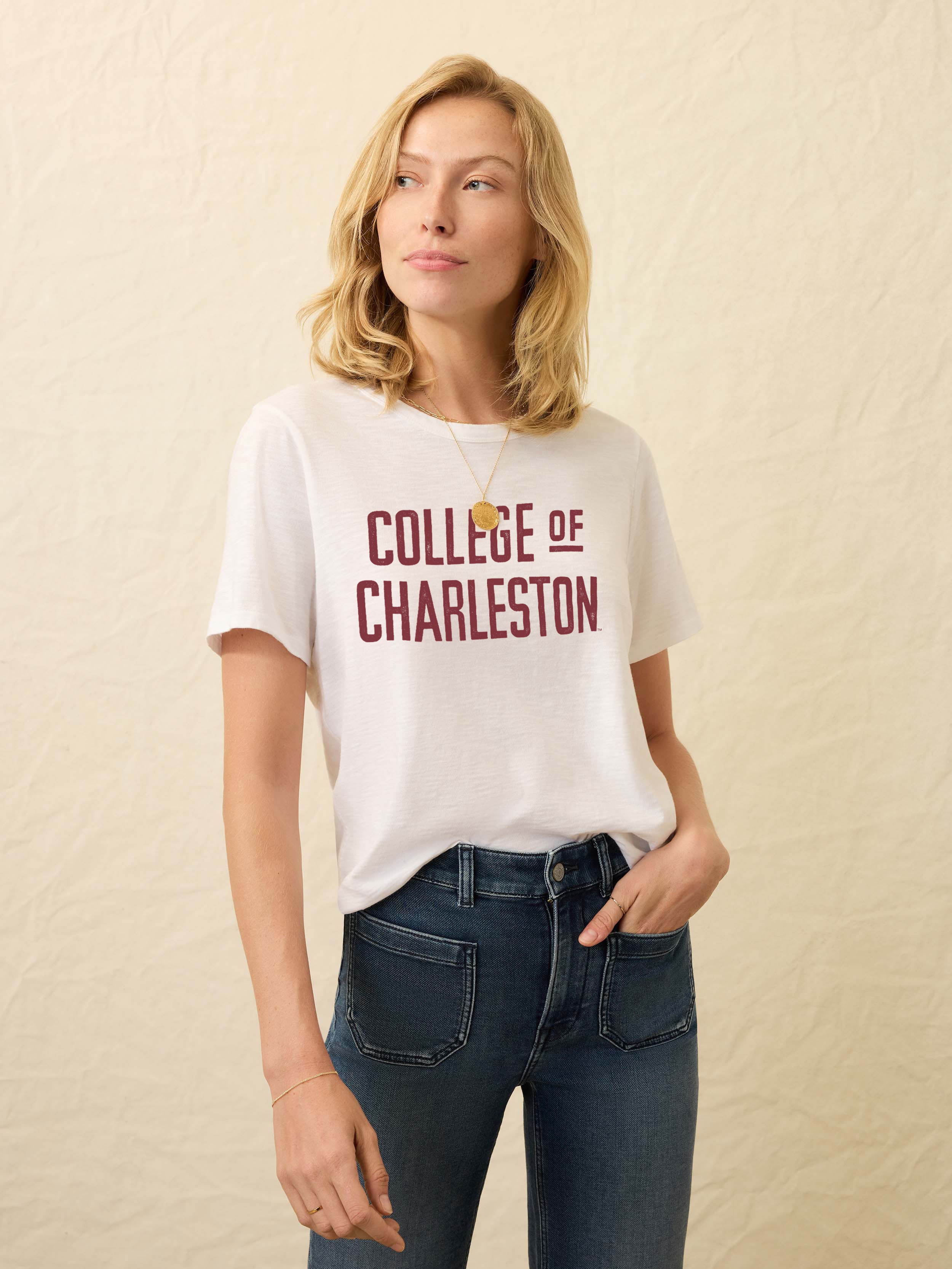 White short sleeve t-shirt with College of Charleston text on a beige background
