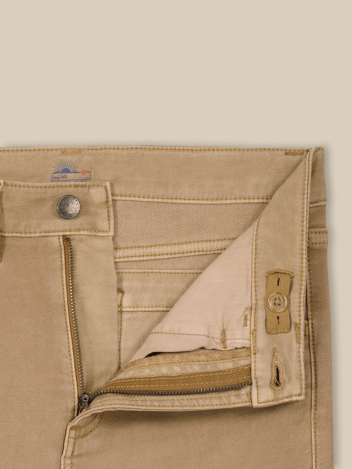 Close up of beige pants with an adjustable waistband, image 7 of 7