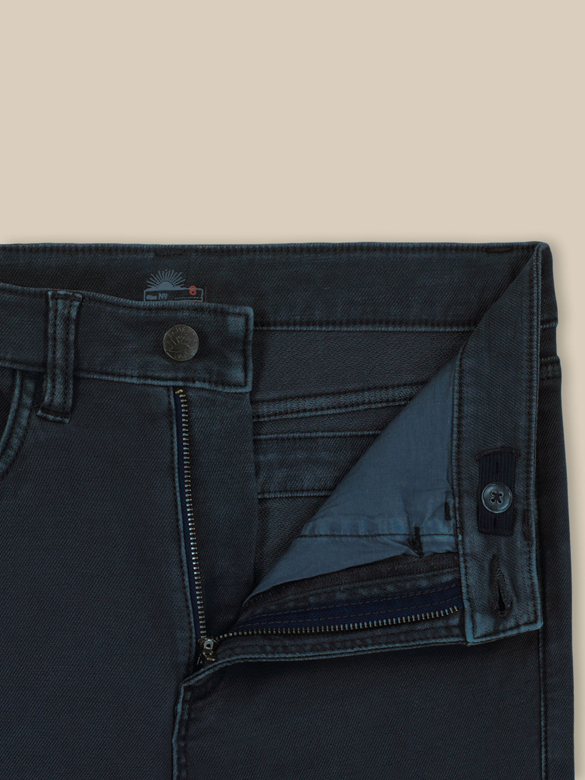 Close up of dark navy pants with an adjustable waistband, image 6 of 6