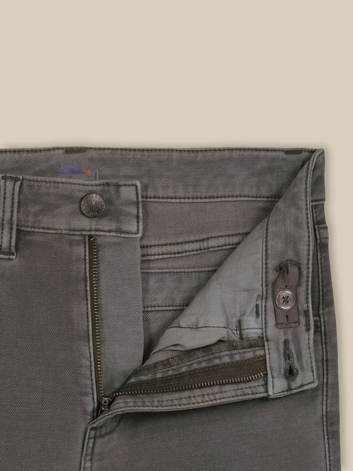 Close up of dark grey pants with an adjustable waistband, image 6 of 6