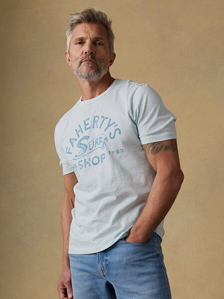 Male model wearing graphic surf shop tee