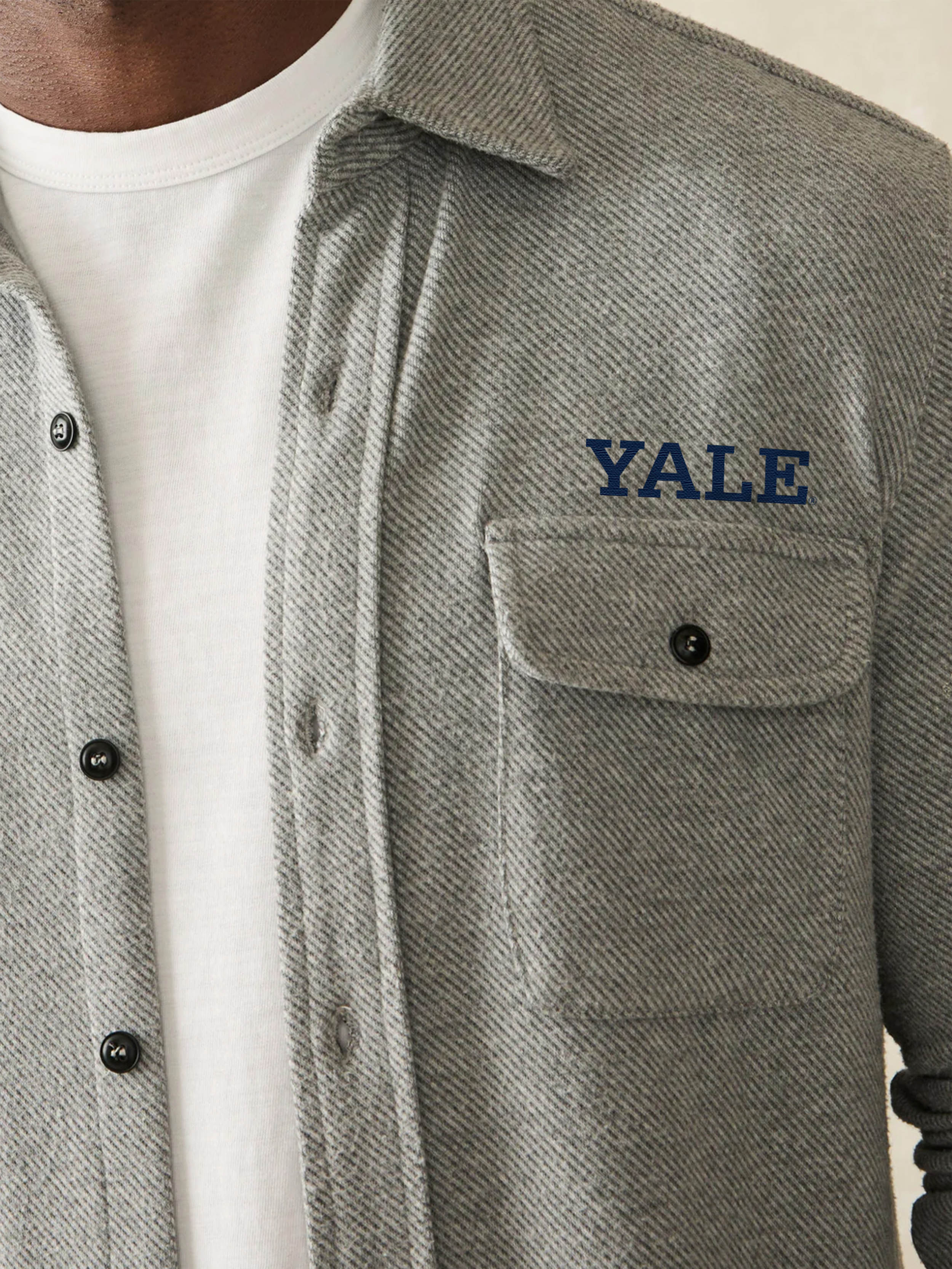 Gray flannel shirt with 'YALE' embroidery on a white background