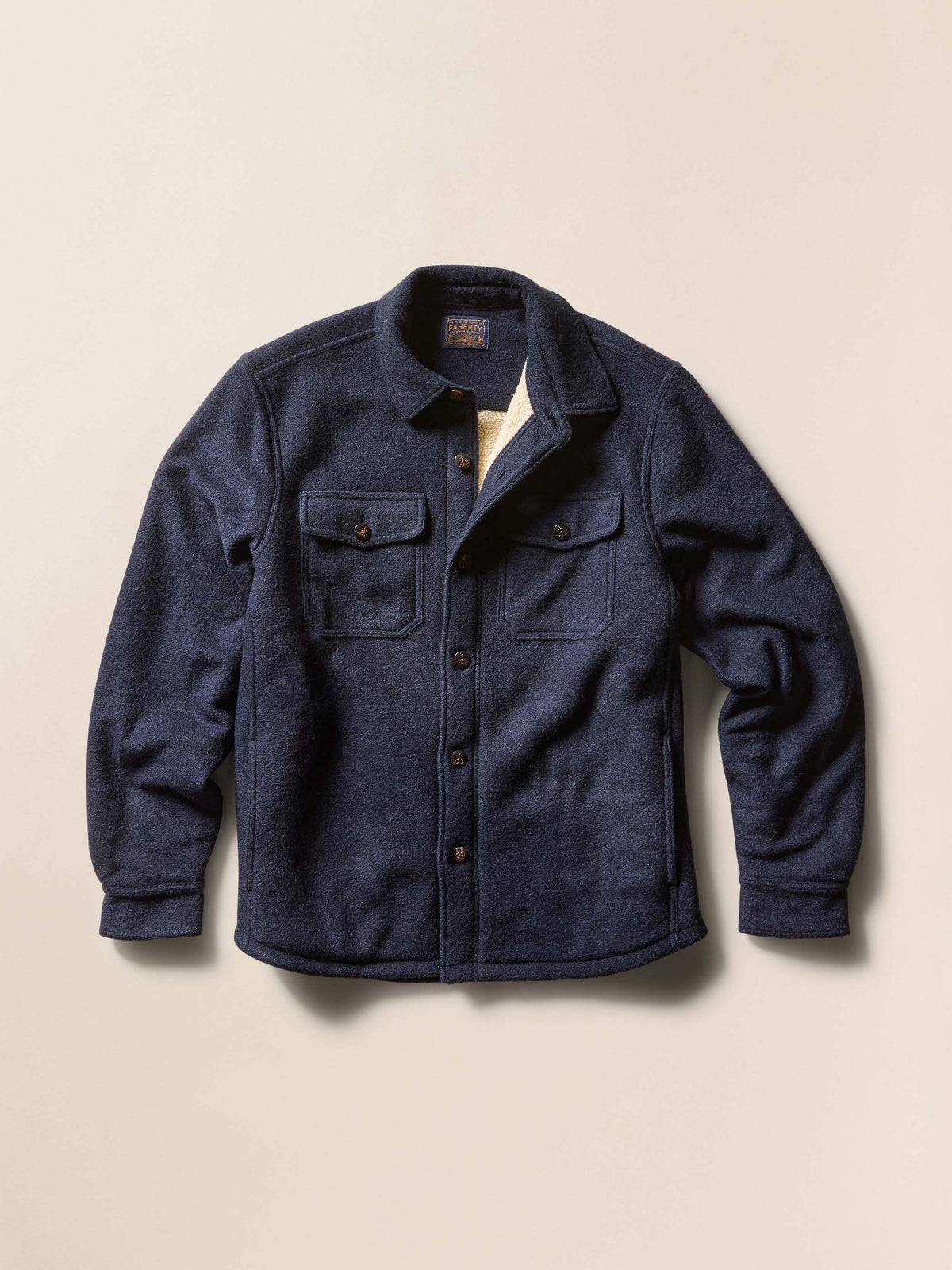 Navy blue jacket on a beige background, image 3 of 6