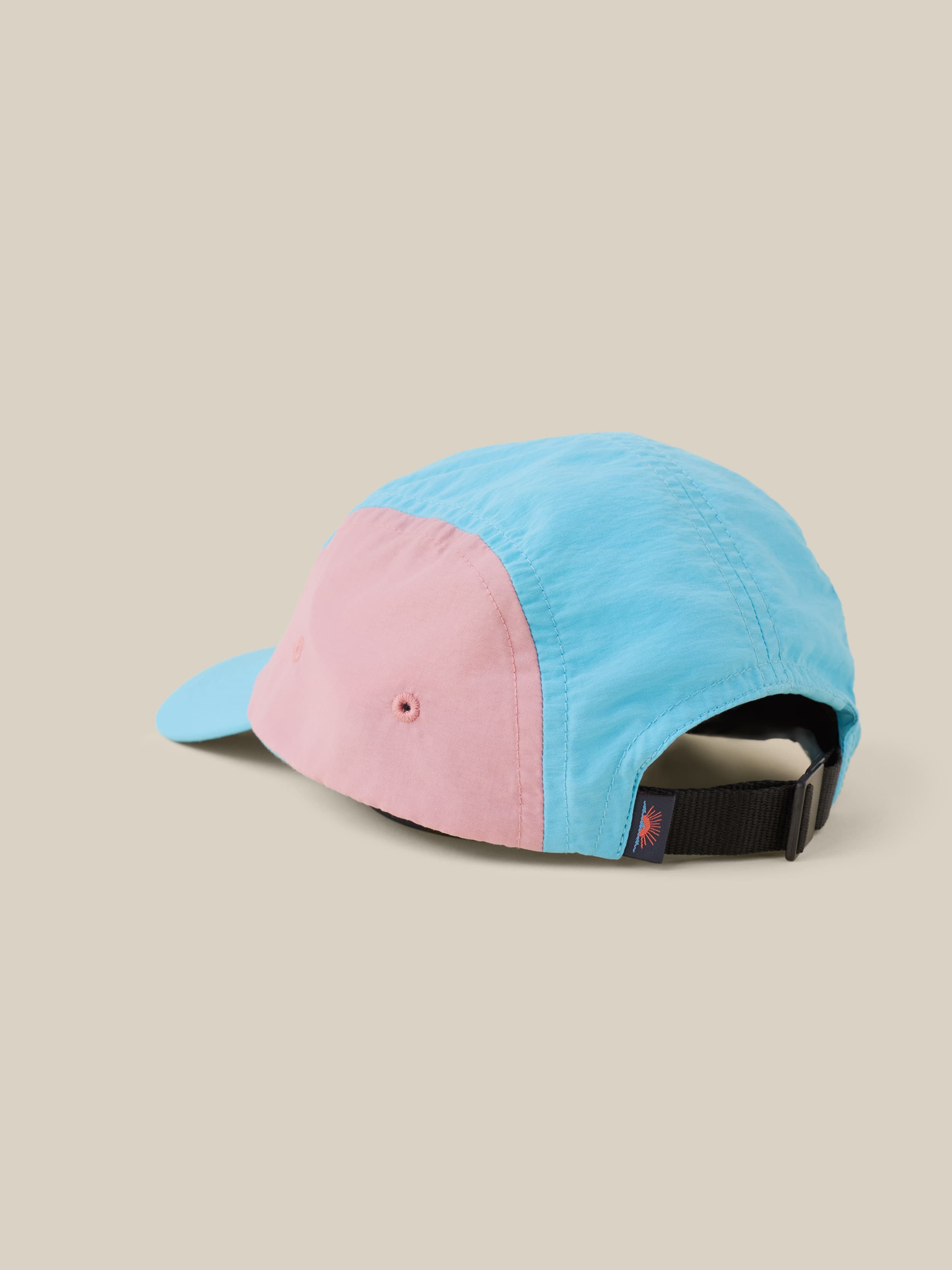 Pink and blue hat with Faherty tag on the back
