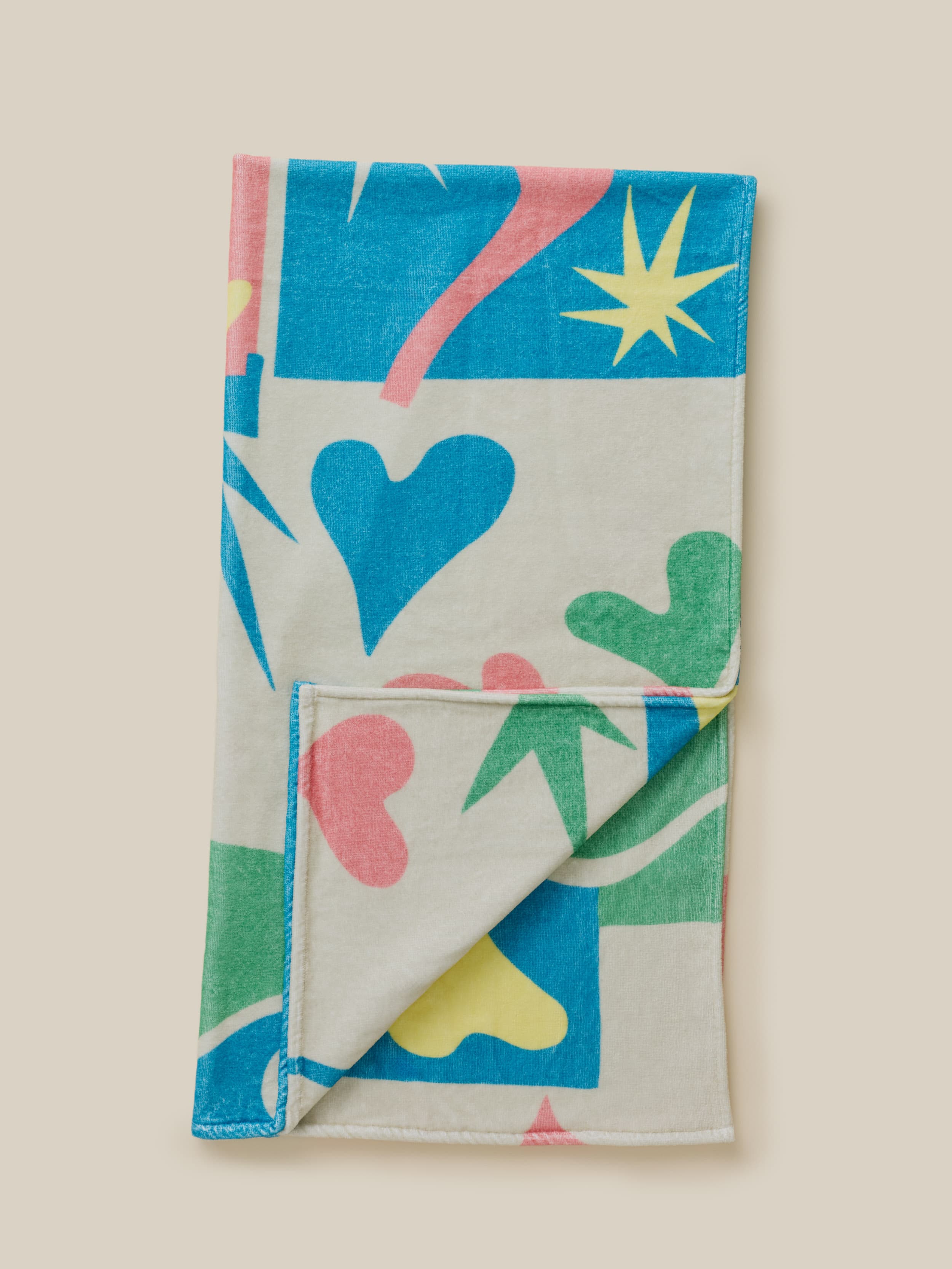 Multicolor printed towel on a beige background