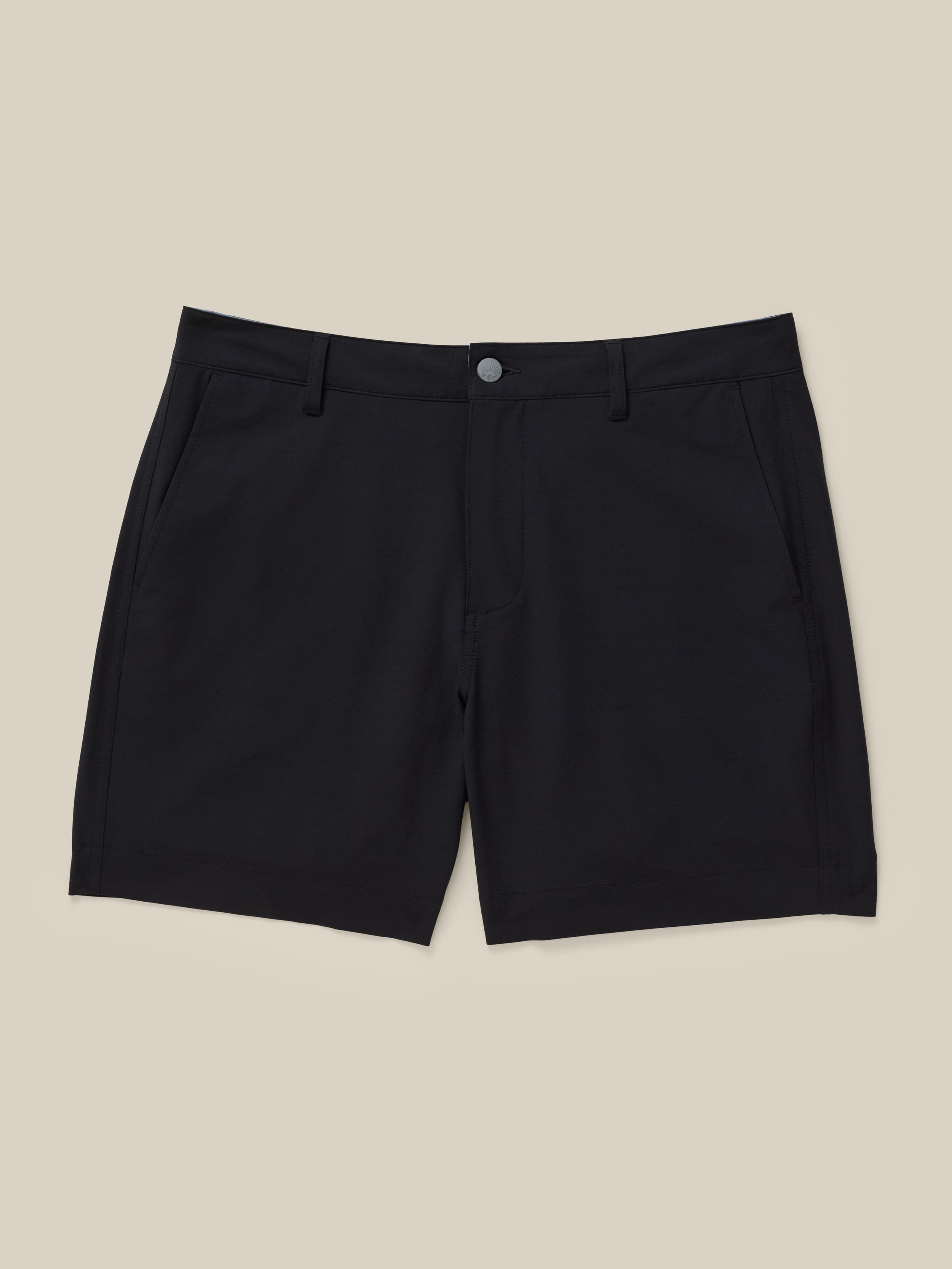 Black shorts on a beige background