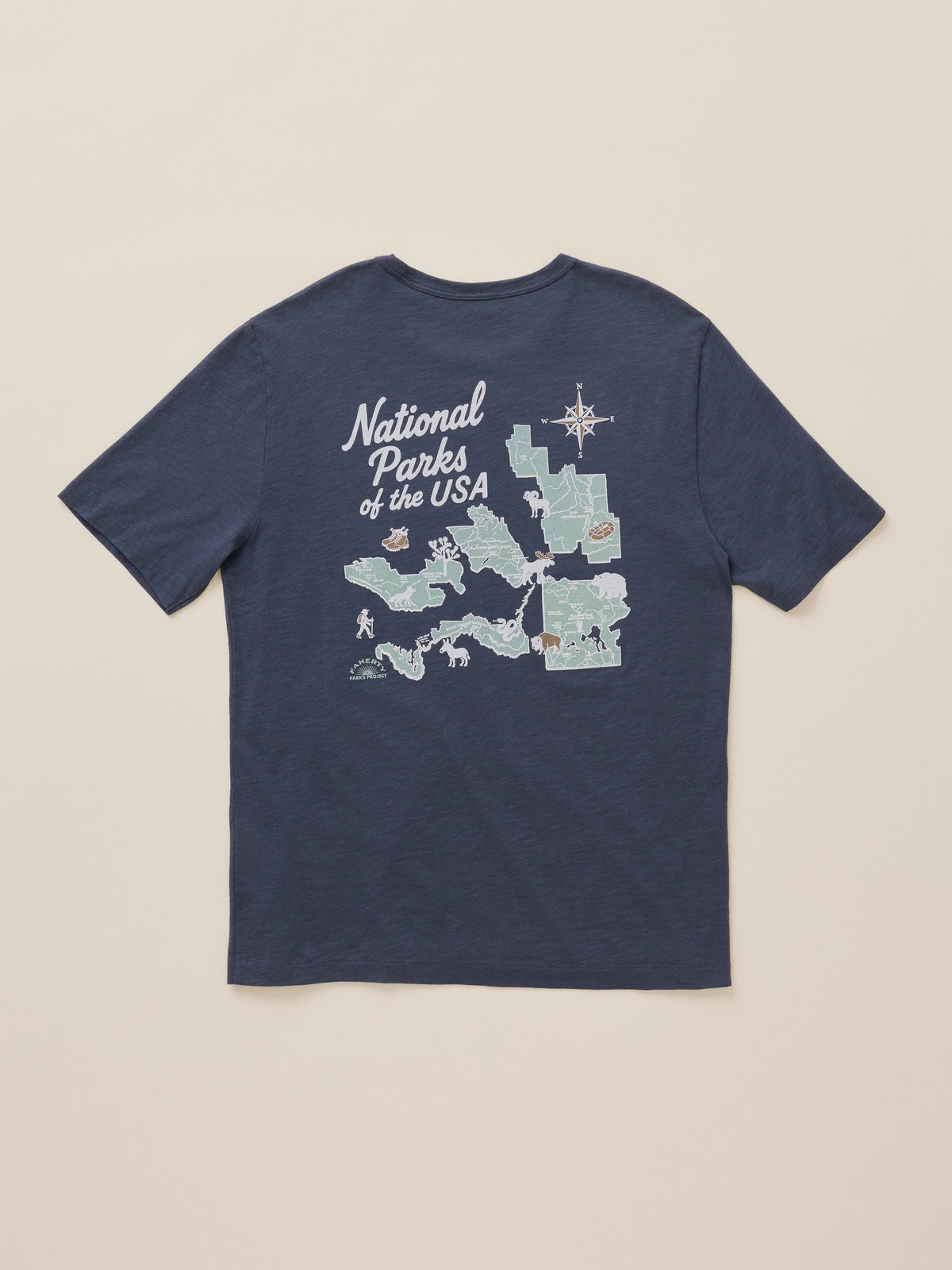 A navy blue short-sleeve t-shirt with a graphic print on the front featuring a map of National Parks of the USA, displayed flat against a light beige background., image 7 of 7