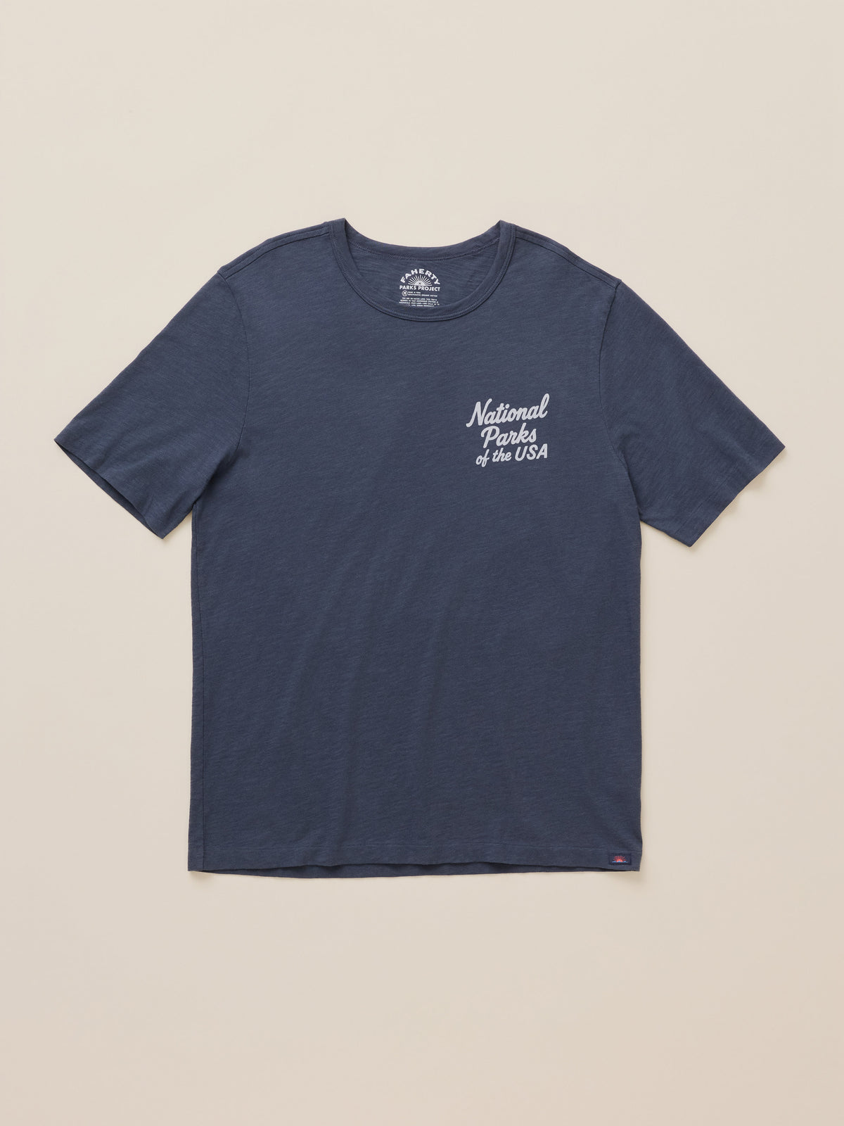 A navy blue short-sleeve crewneck t-shirt with 'National Parks of the USA' printed in white script on the left chest, displayed flat against a light beige background., image 6 of 7