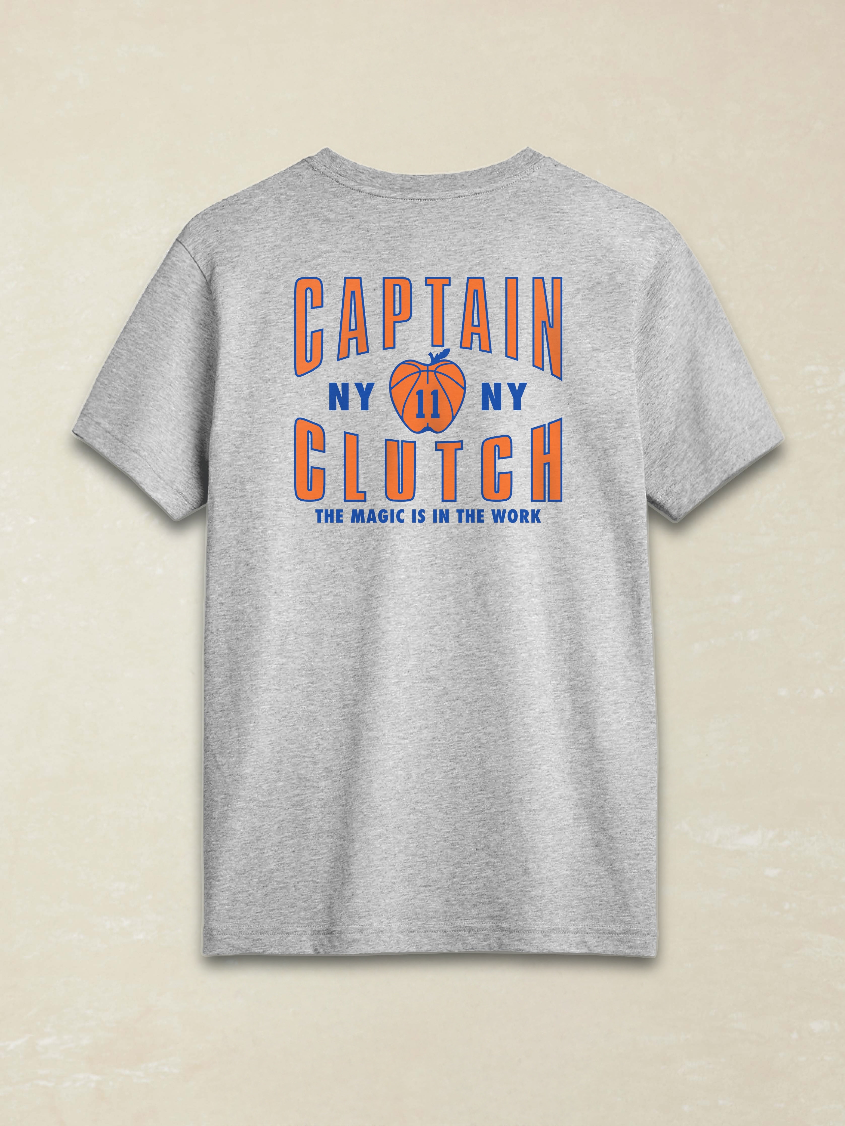 Gray t-shirt with 'Captain Clutch' text and basketball graphic on a beige background