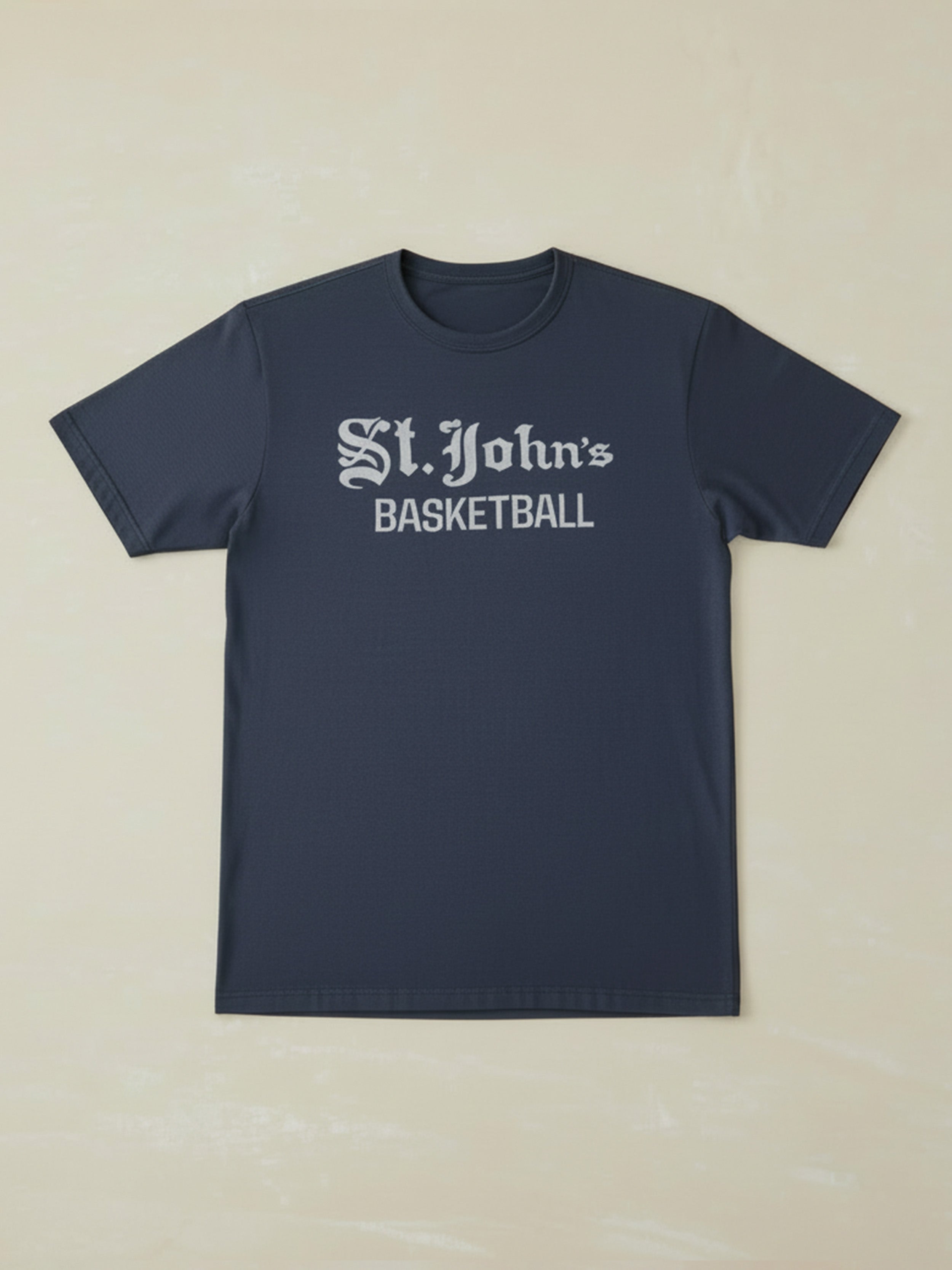 Navy blue t-shirt with St. John's Basketball text against a beige background
