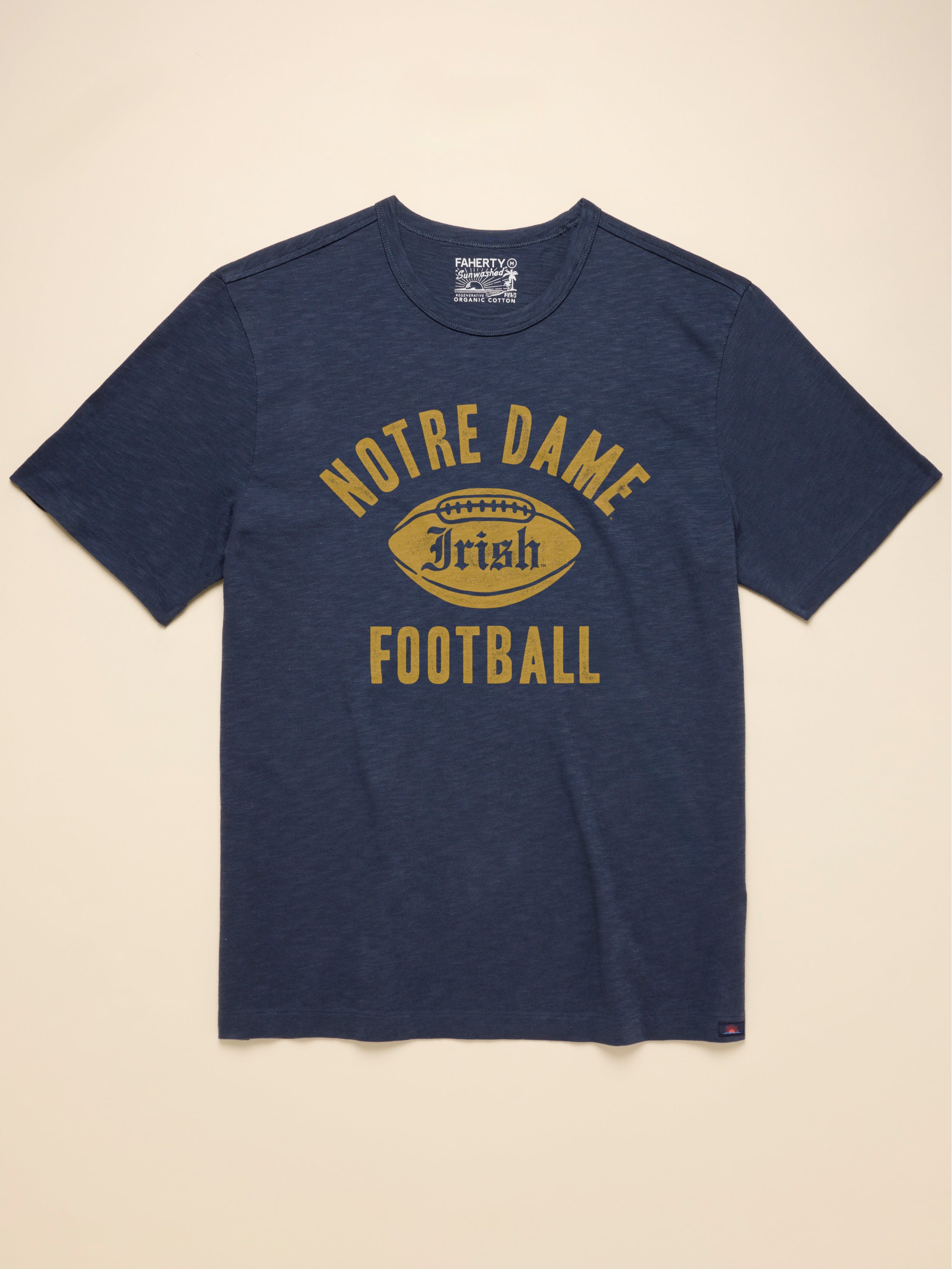 Navy short sleeve t-shirt with Notre Dame graphic at the center front against a beige background