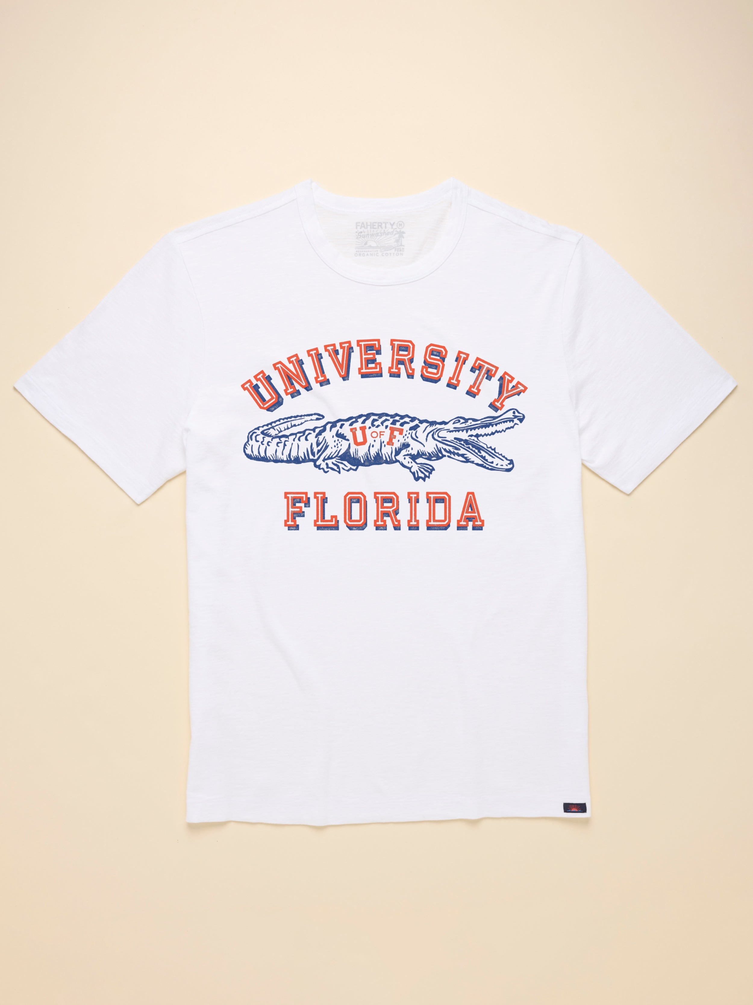 White t-shirt with University of Florida graphic on the front against beige background
