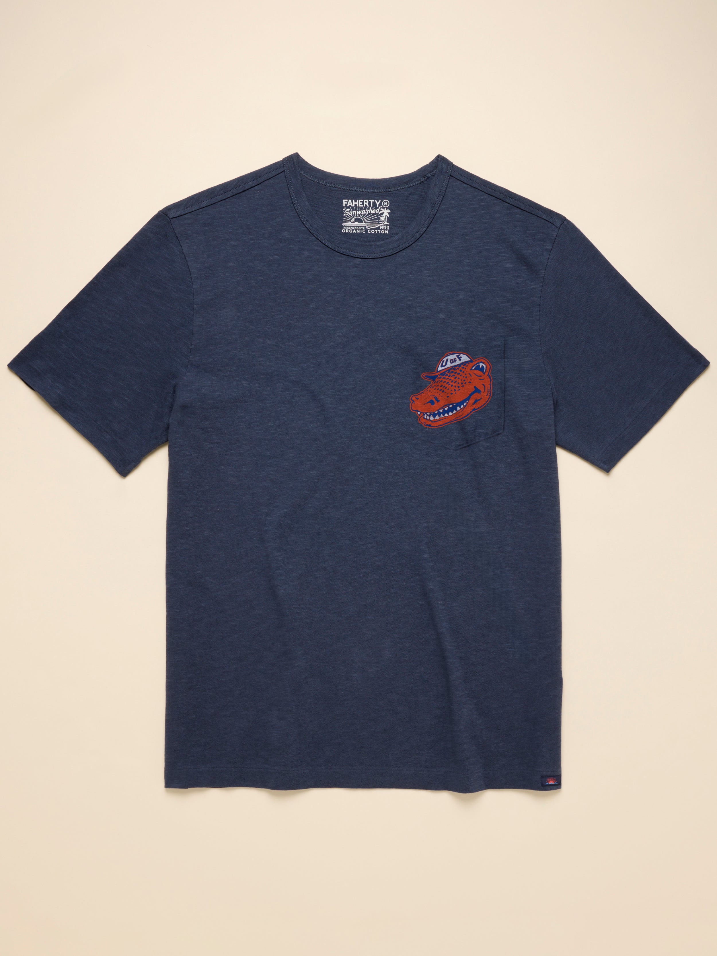Navy blue t-shirt with a Florida logo on the left chest against a beige background