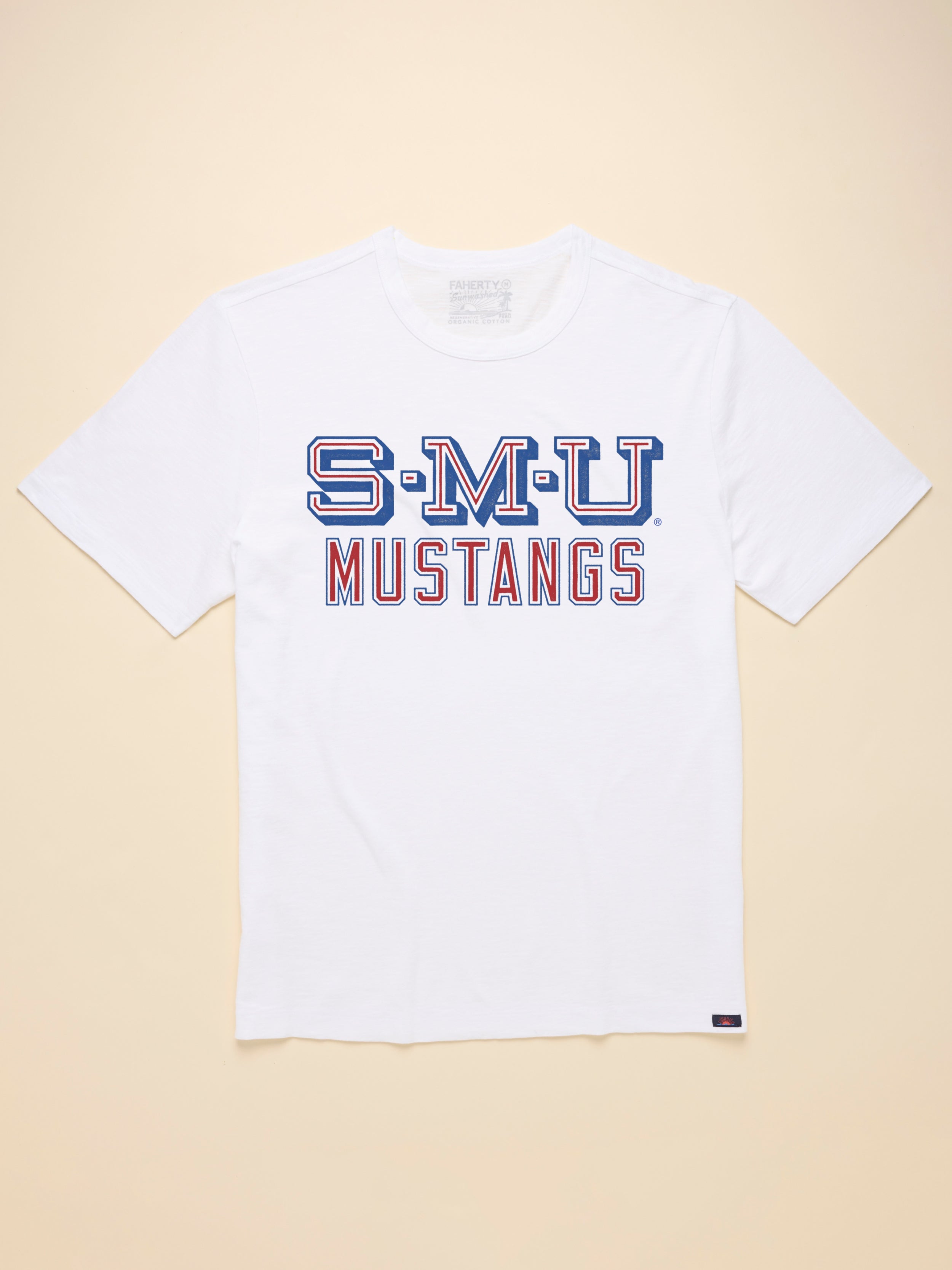 White t-shirt with SMU graphic on the front against a beige background