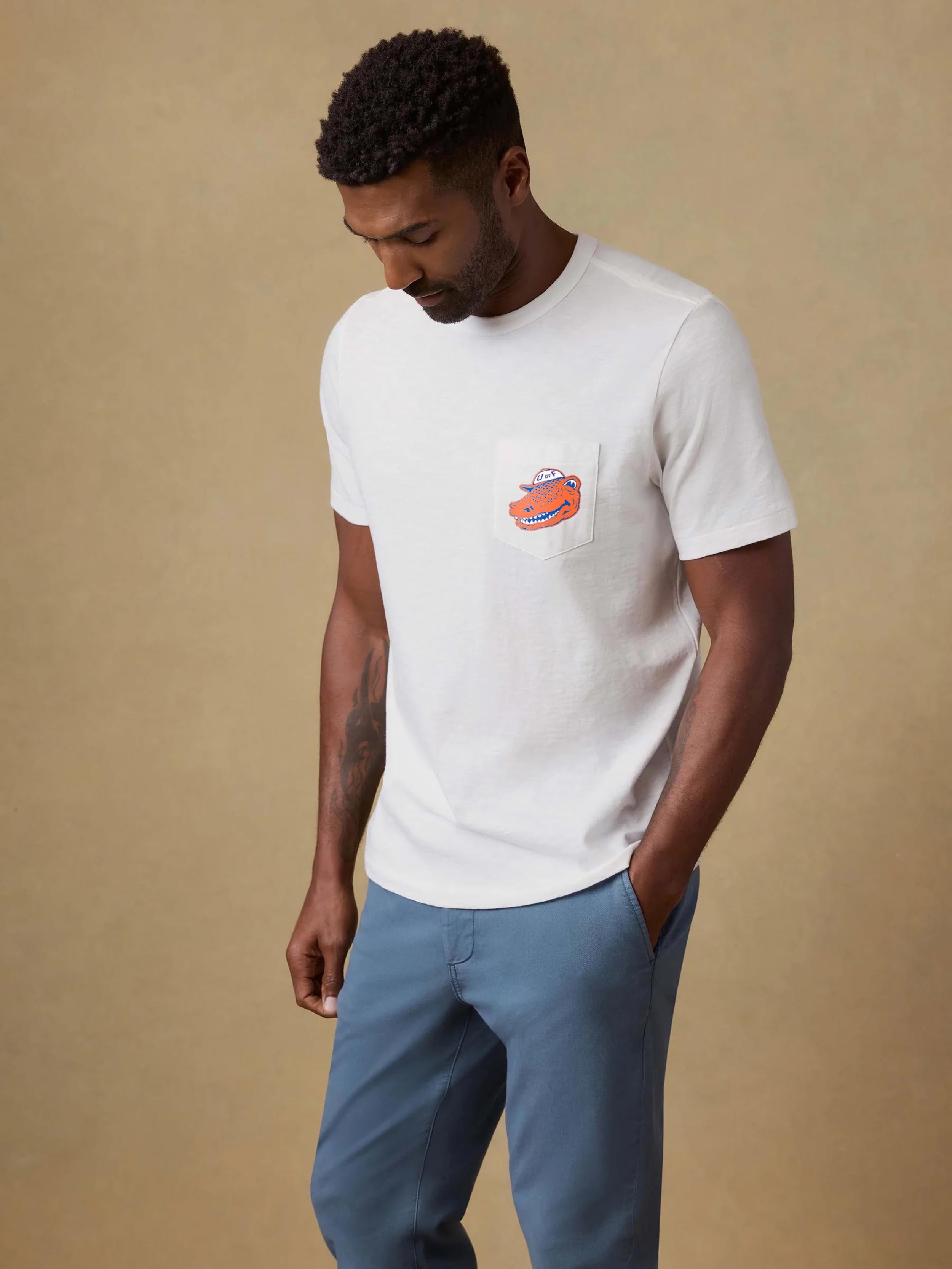 A man wearing a University of Florida tee and blue pants