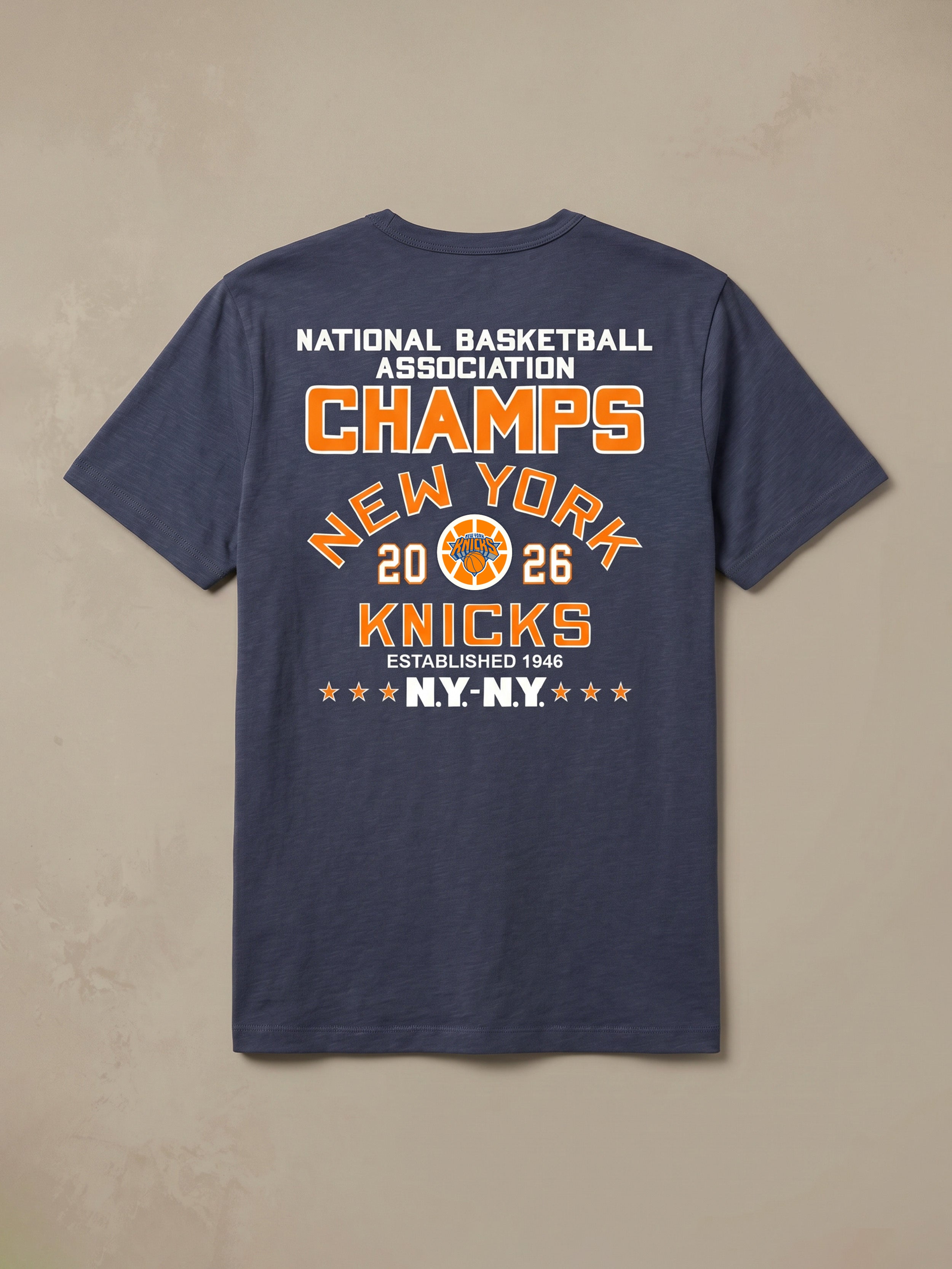 Navy blue t-shirt with New York Knicks championship text against a beige background