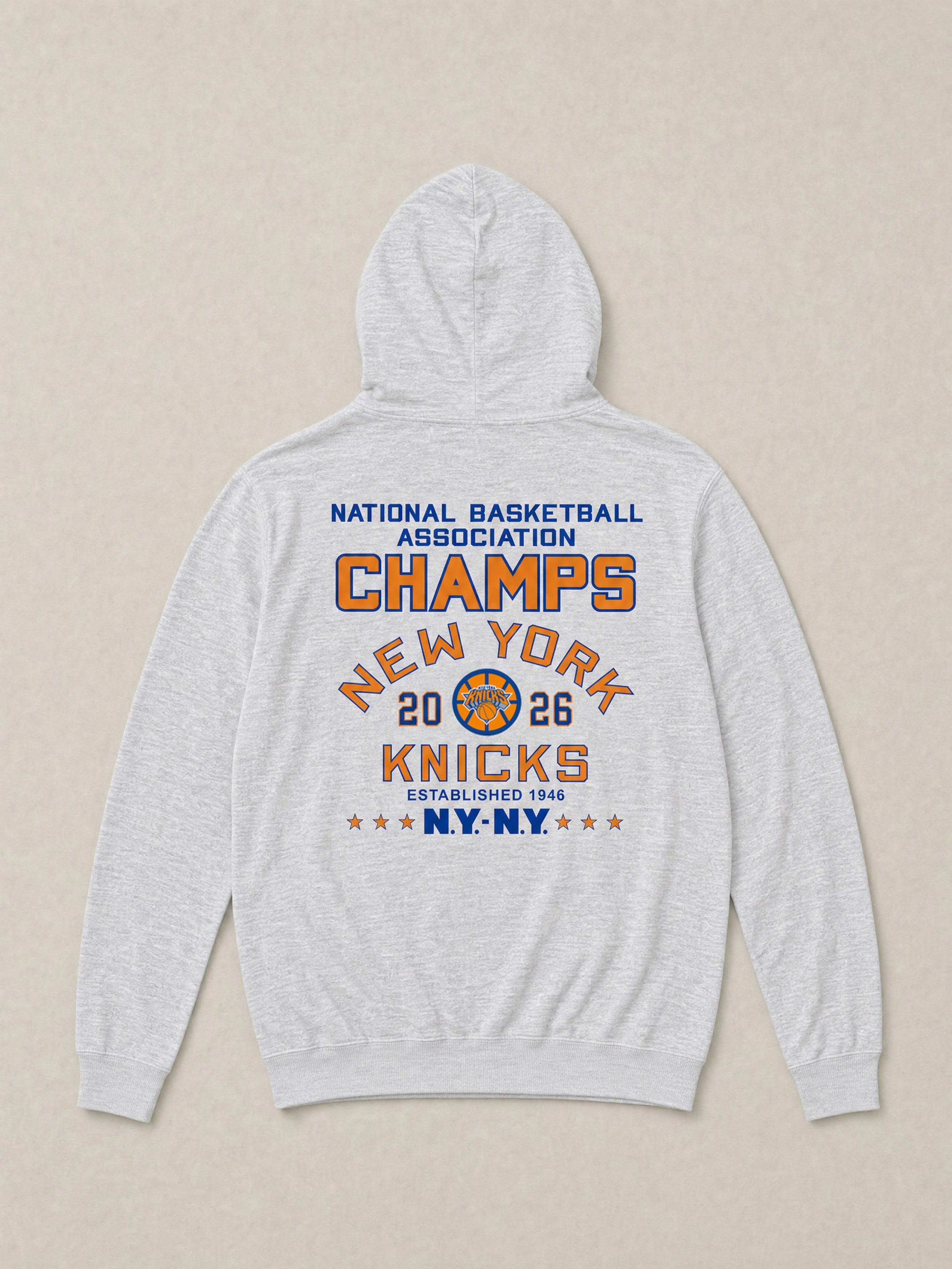 Gray hoodie with New York Knicks championship graphic logo on the back against a beige background