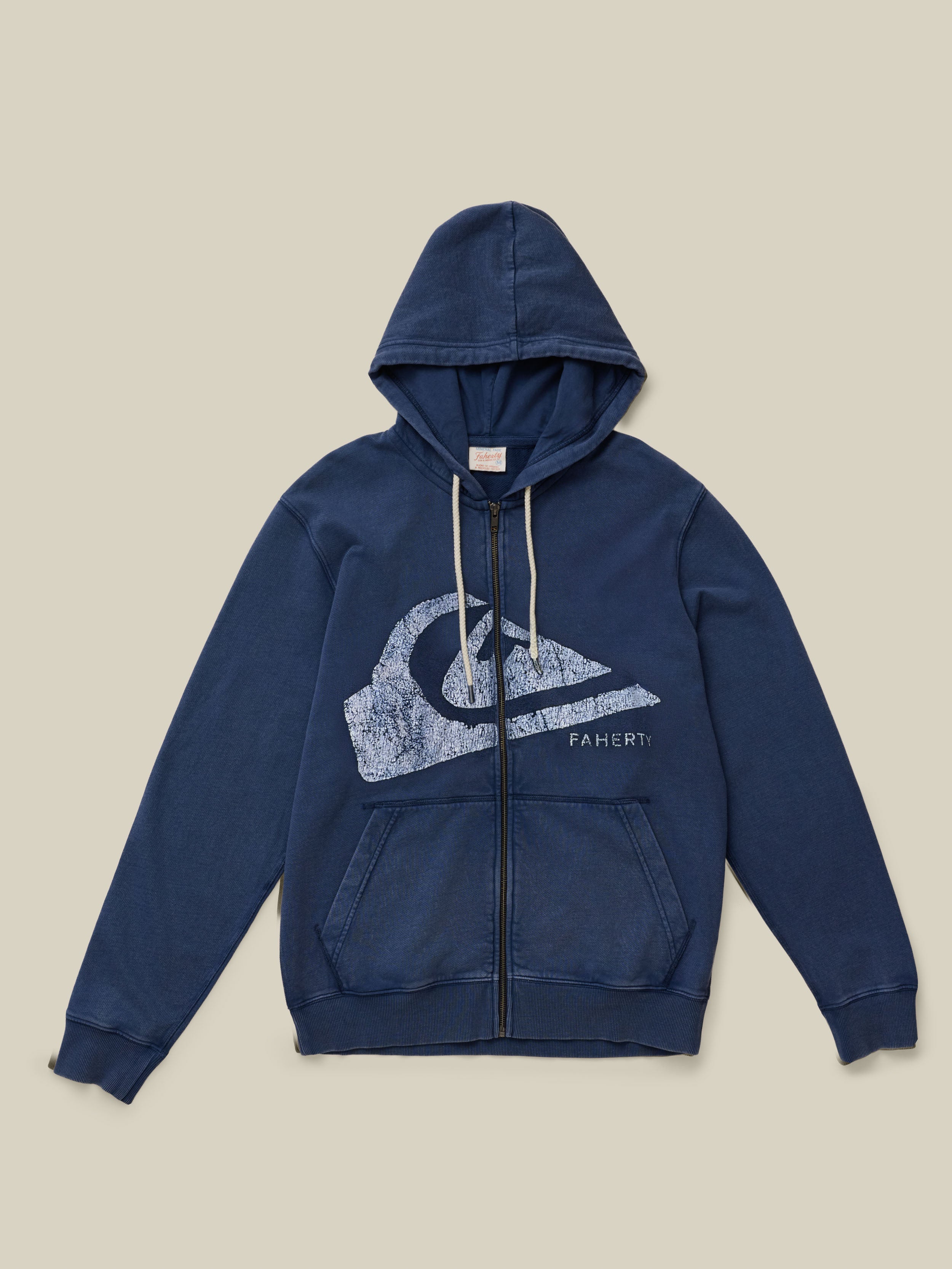 Blue zip up hoodie with Faherty x Quiksilver graphic on the center chest