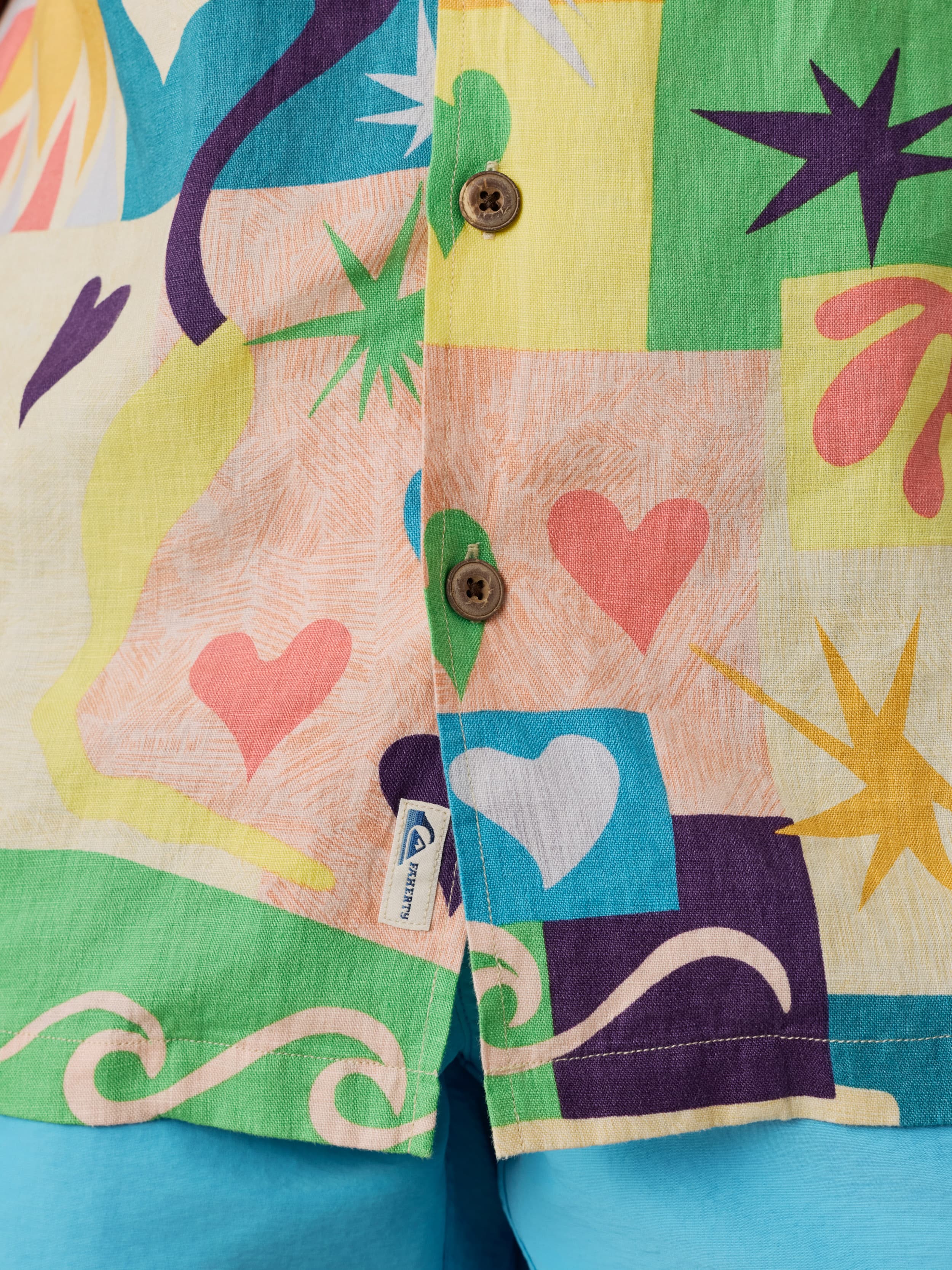 Colorful shirt with abstract patterns and a visible Quiksilver x Faherty brand label.