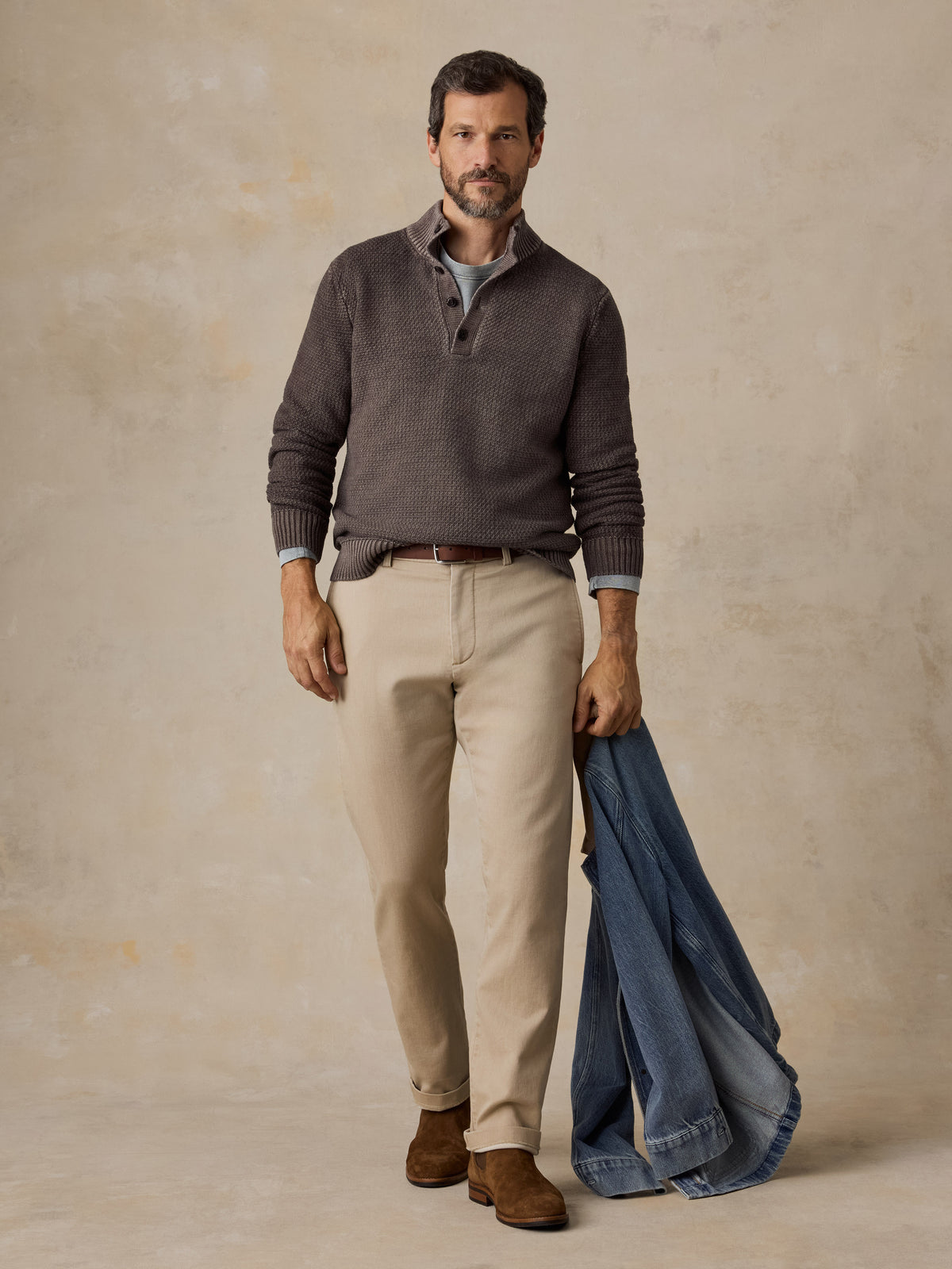Man wearing a brown sweater and chino pants , image 3 of 5