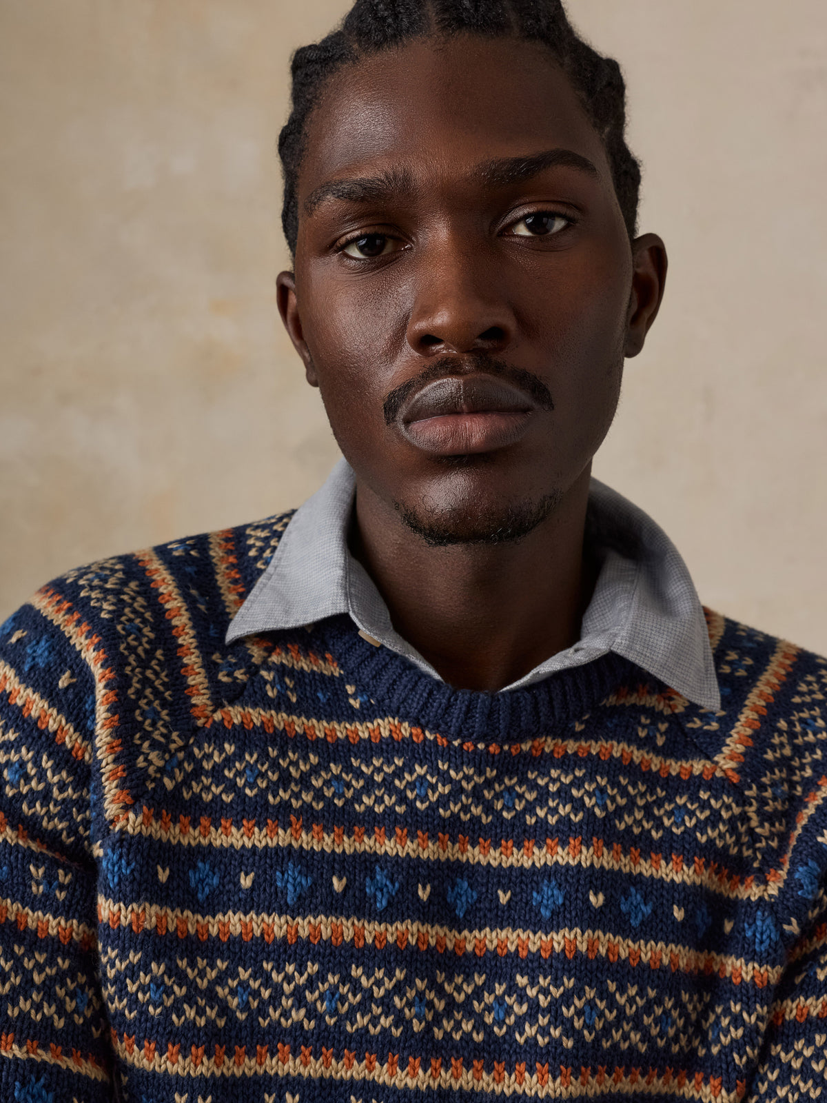 Close up of a man wearing a nordic printed sweater, image 4 of 6