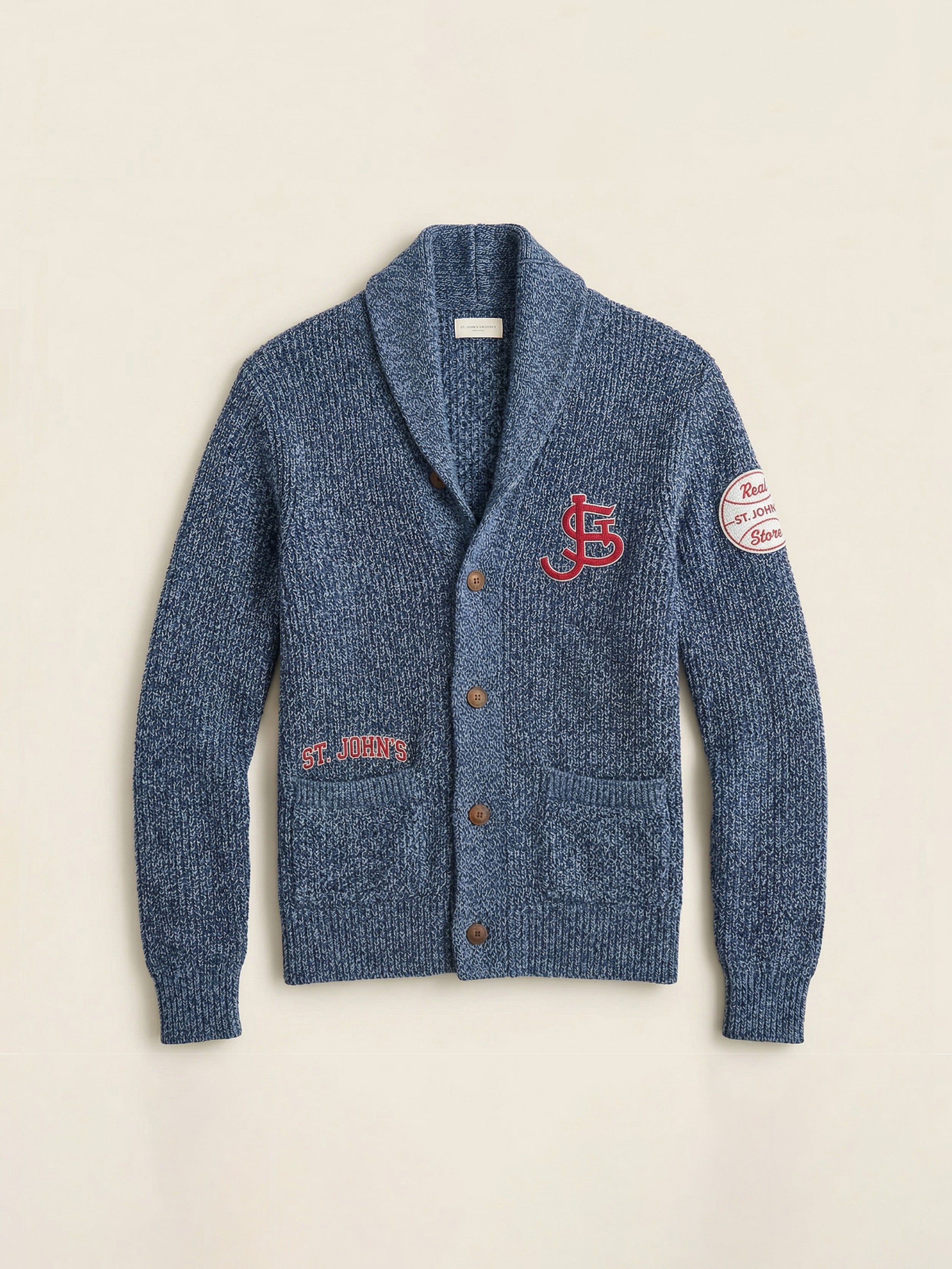 Blue cardigan with embroidered St. John's logos against a beige background