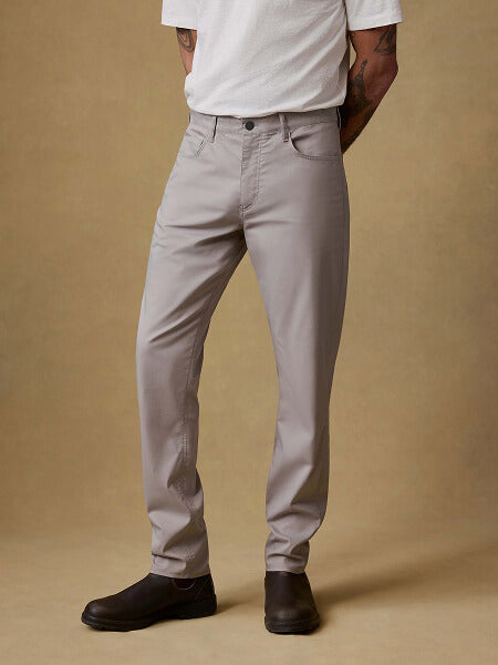 Lower half of model wearing movement 5-pocket pants