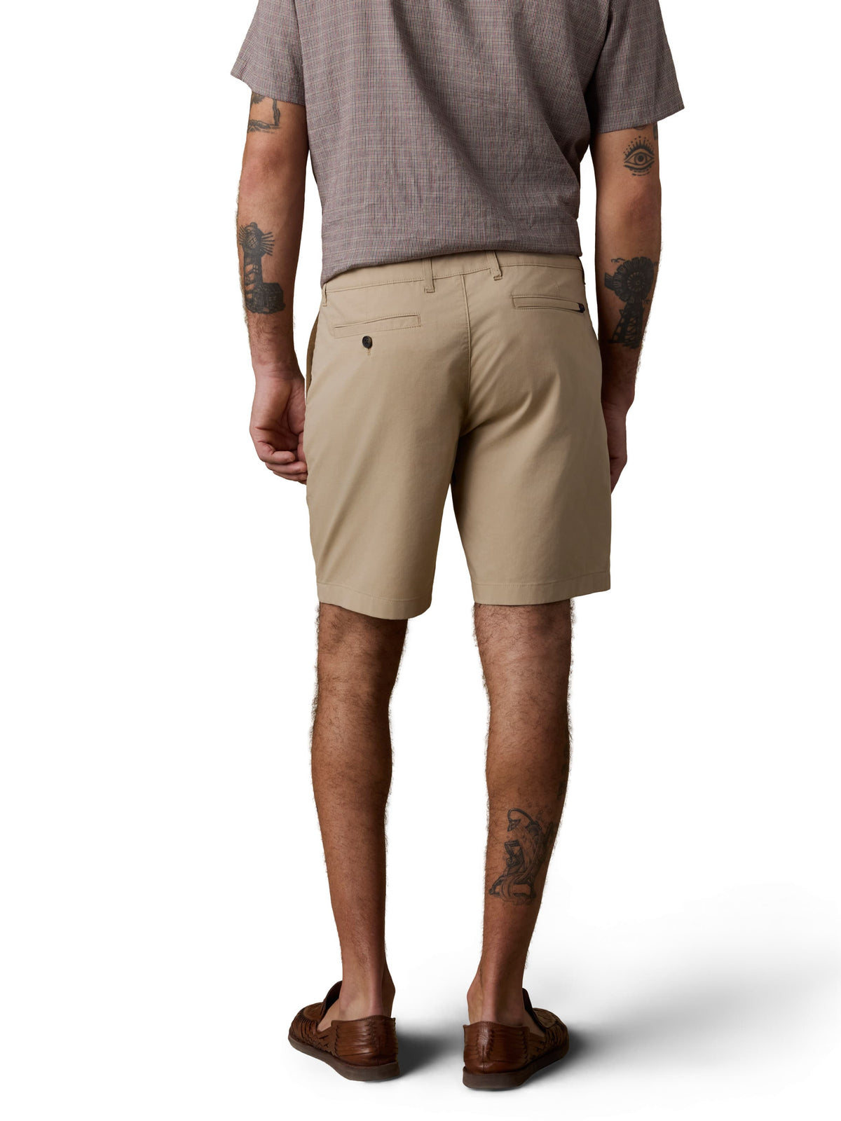 A man viewed from behind wearing a brown button up shirt, beige shorts, and brown shoes, image 3 of 3