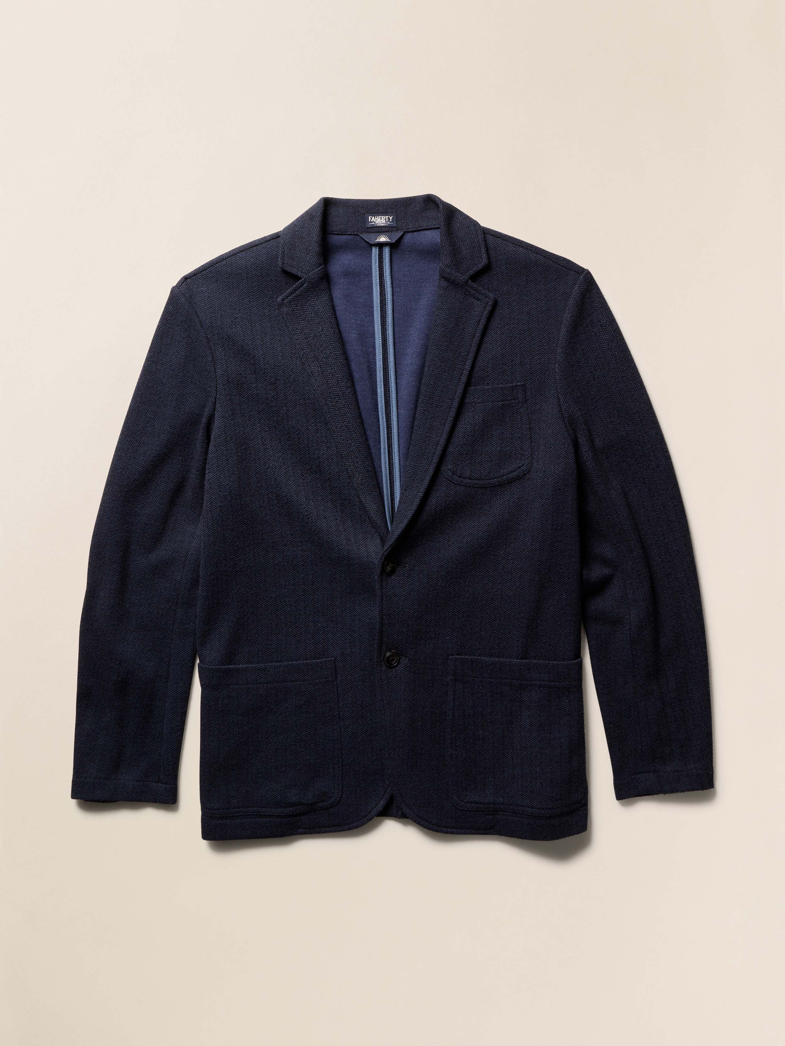 Navy blazer on a beige background