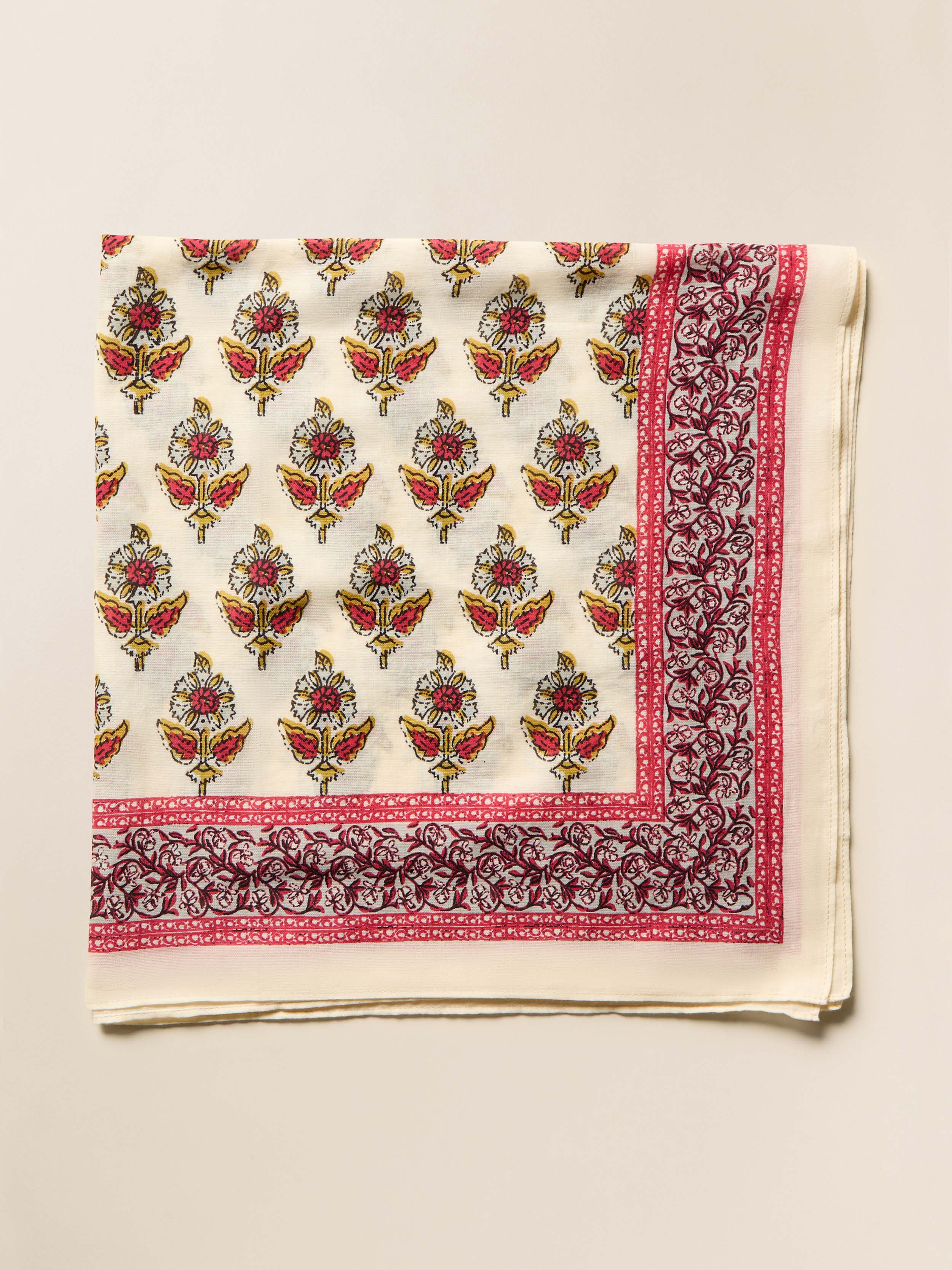 Decorative bandana with floral pattern on a beige background