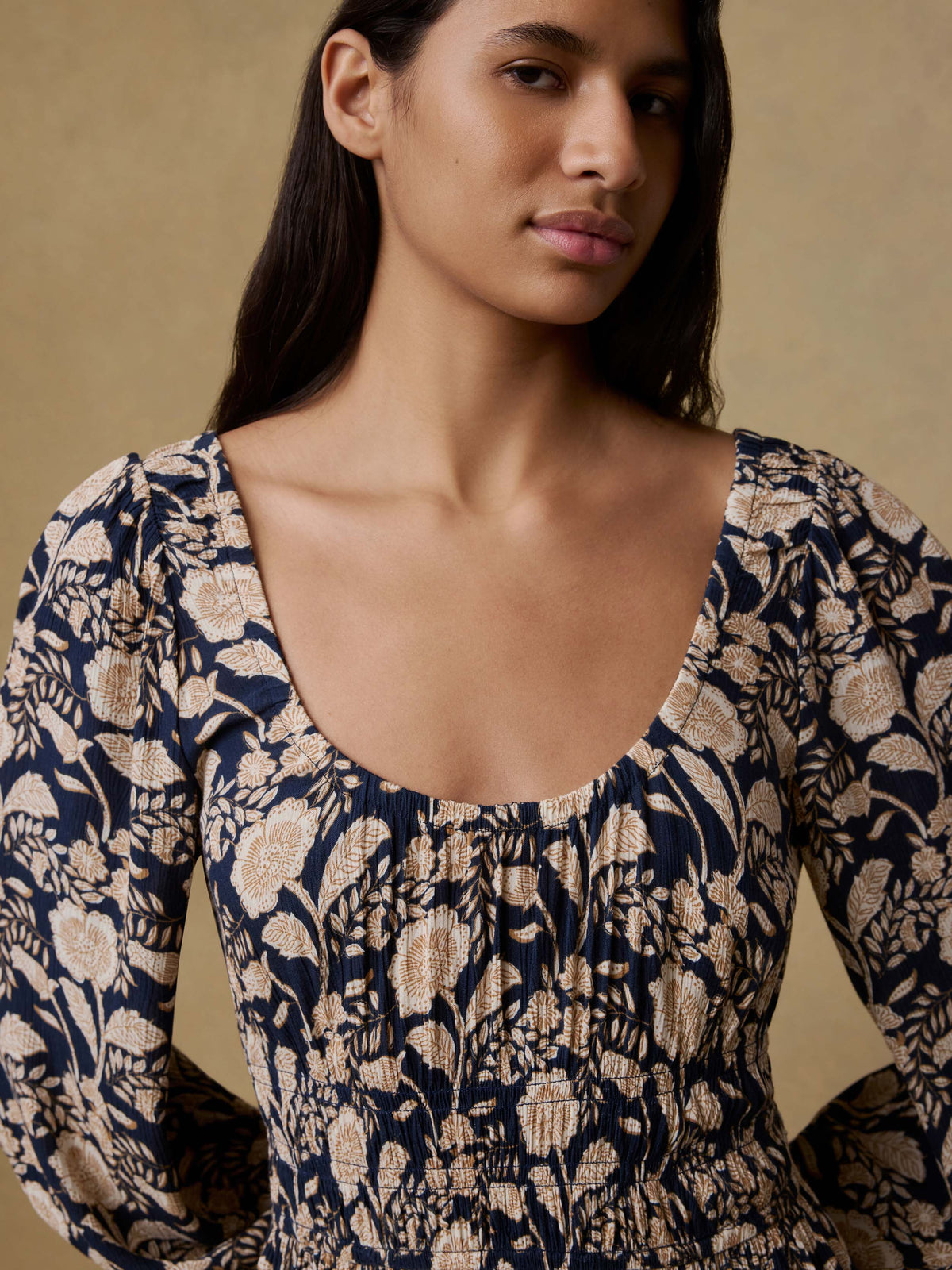 Close up of a woman wearing a floral printed dress, image 5 of 5