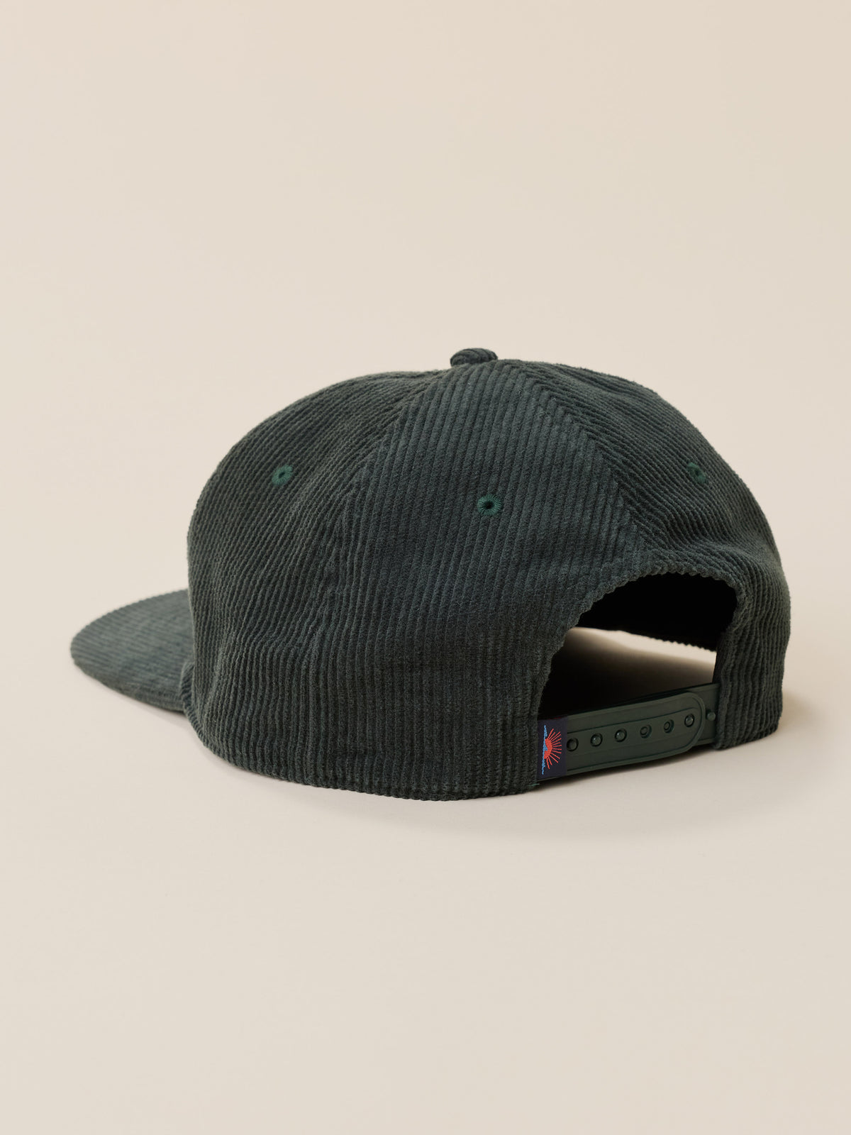 Green corduroy snapback hat against a warm beige studio background, image 3 of 3