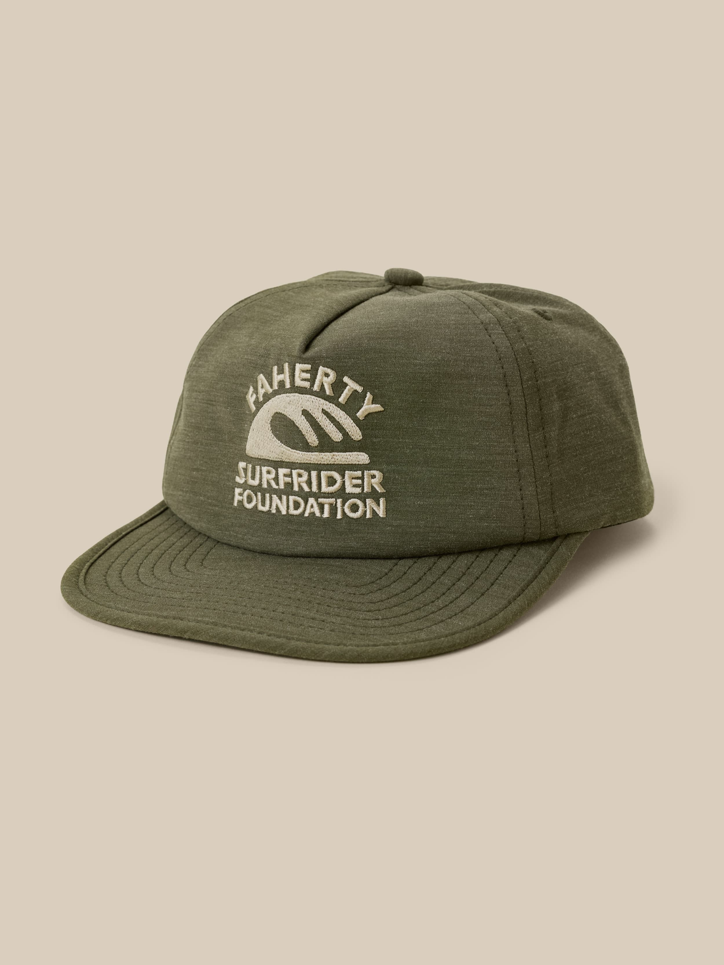 Green cap with 'Faherty x Surfrider Foundation' logo on a beige background