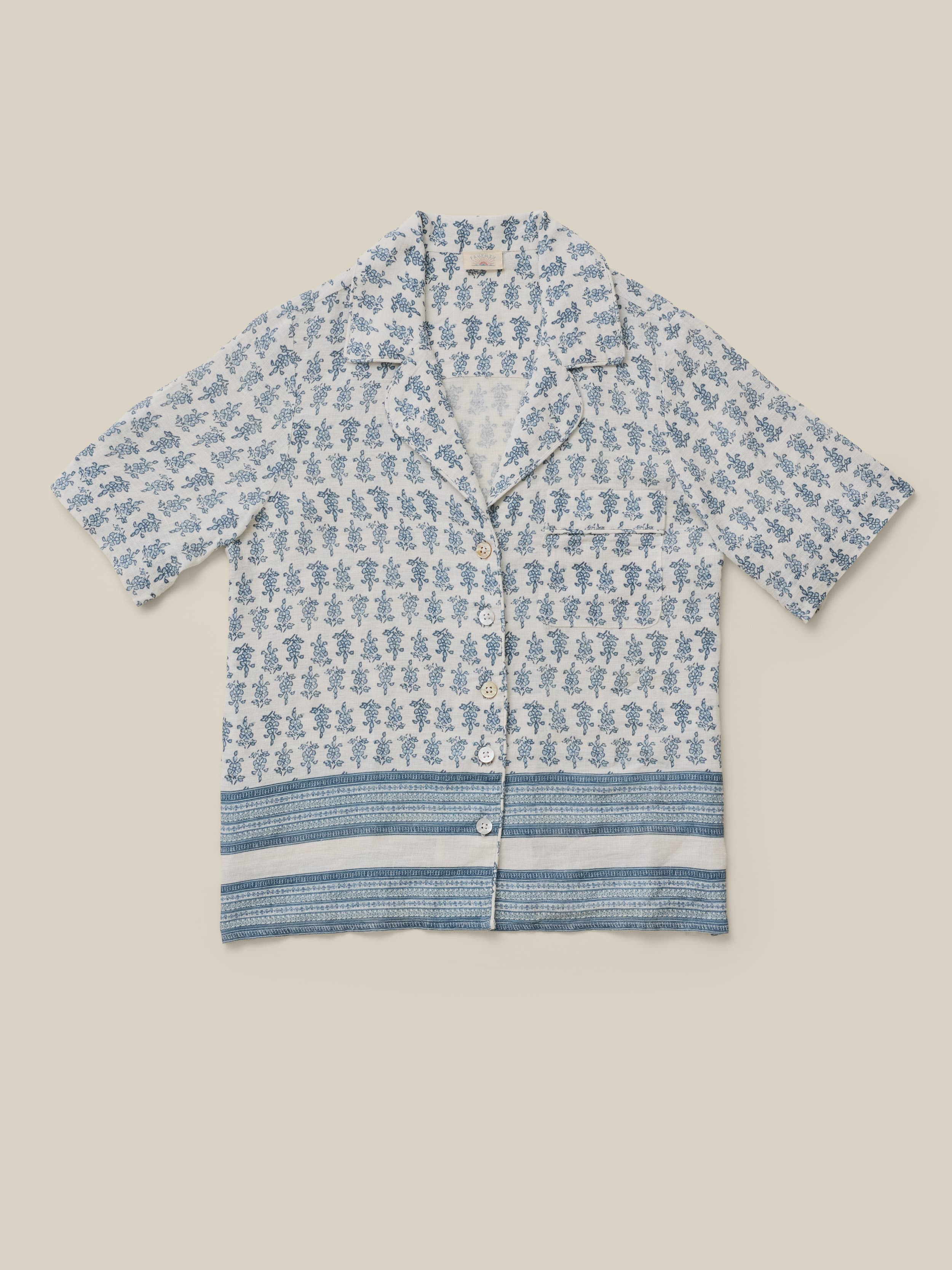 Blue patterned shirt on a beige background