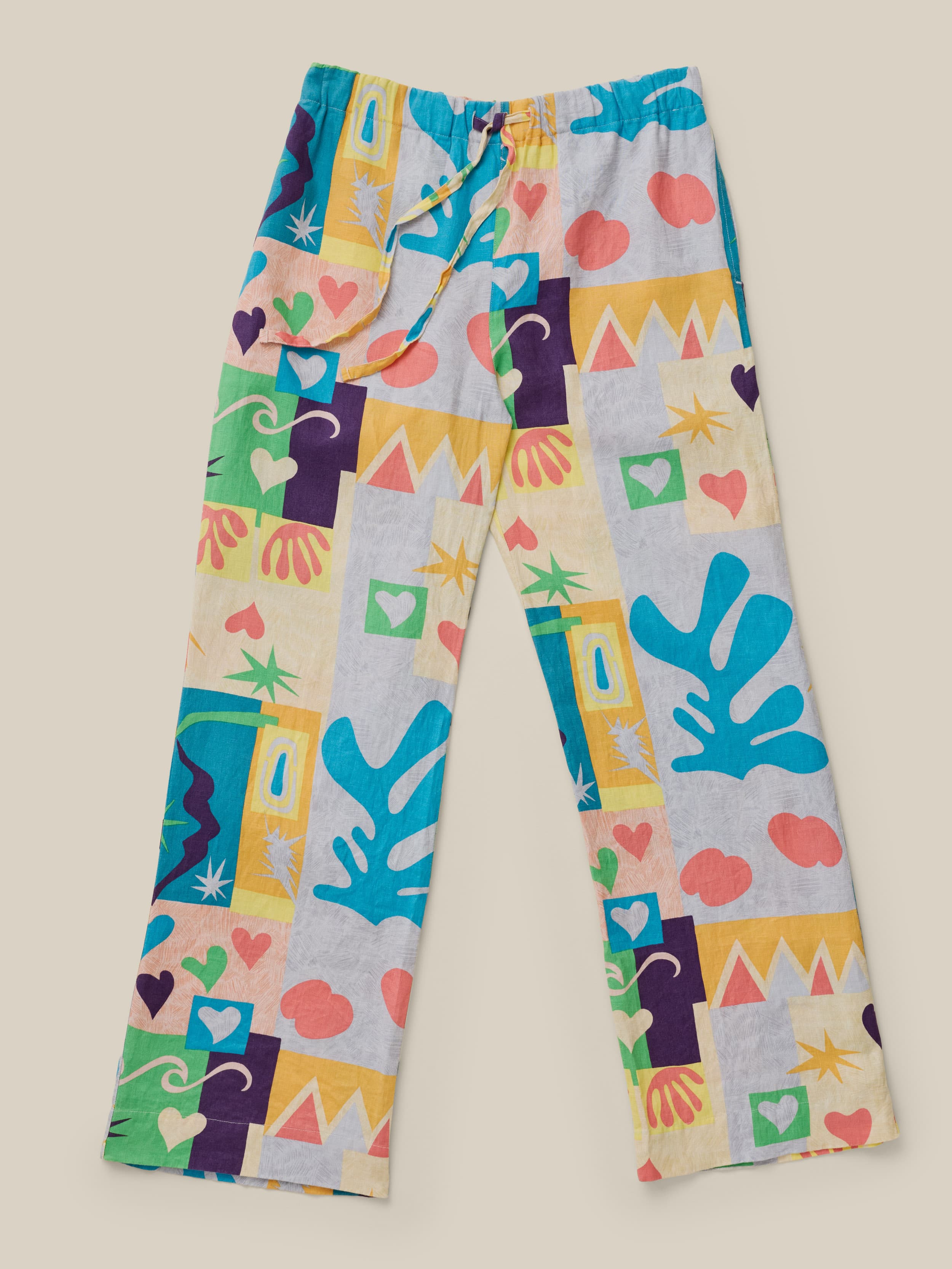 Colorful patterned pants on a beige background