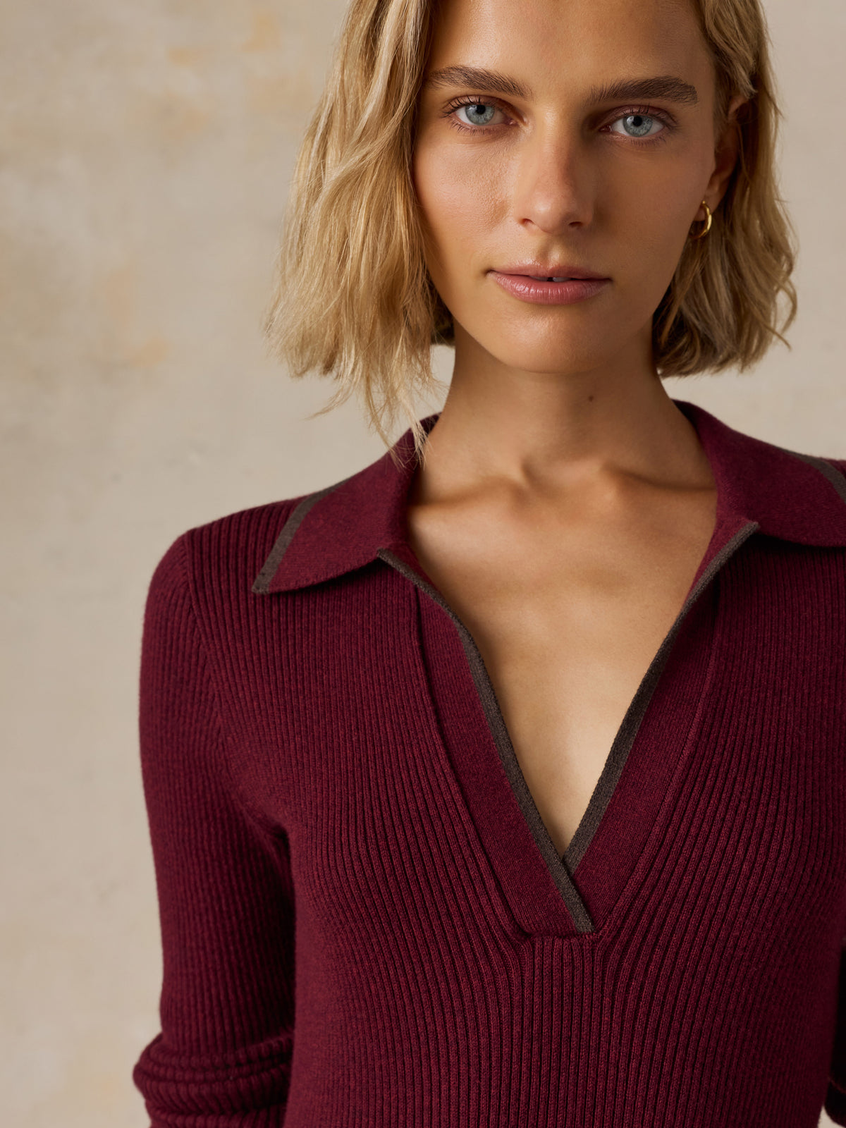 Close up of a woman wearing a burgundy dress, image 6 of 7