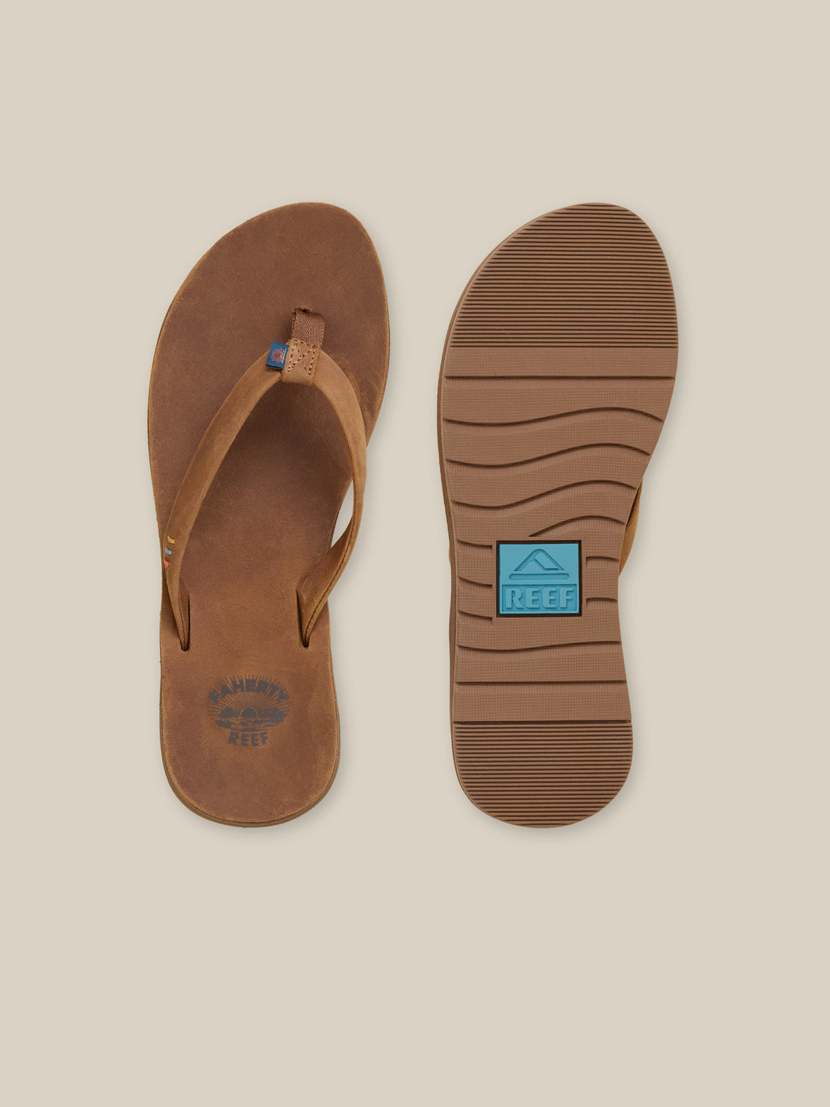 Brown sandal with a visible REEF logo on a beige background, image 2 of 3