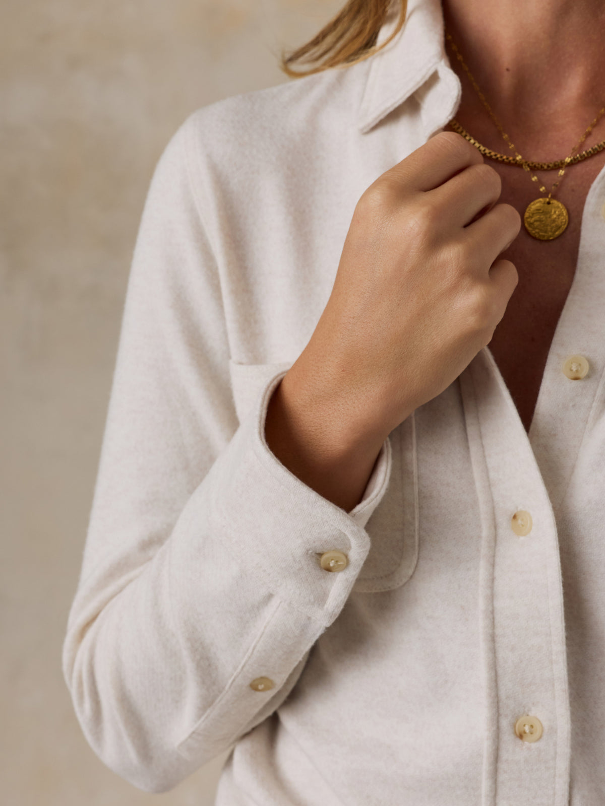 Close up of a woman wearing a white shirt , image 3 of 7
