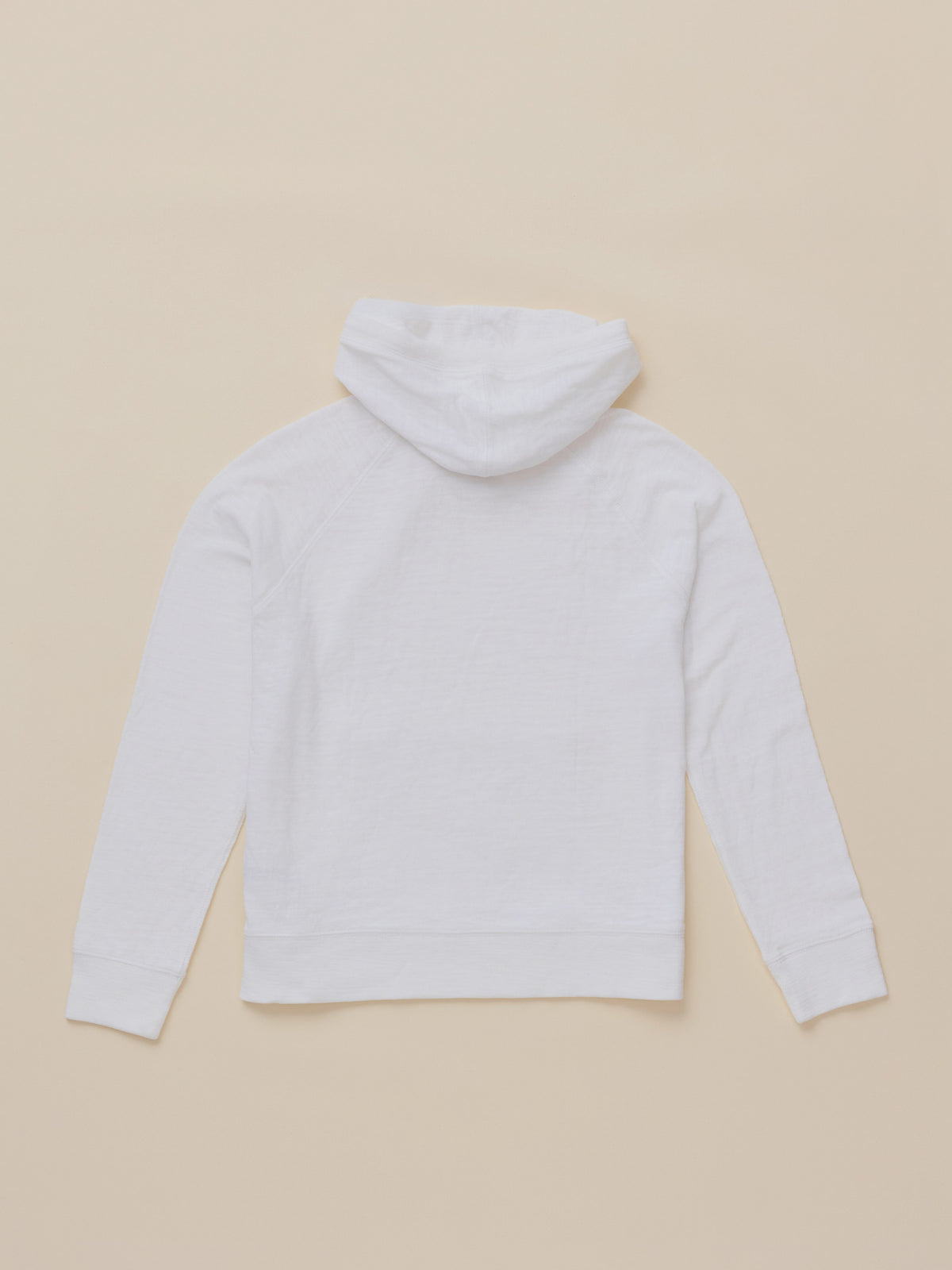 A white long-sleeve hoodie shown from the back, laid flat on a solid beige background., image 7 of 7