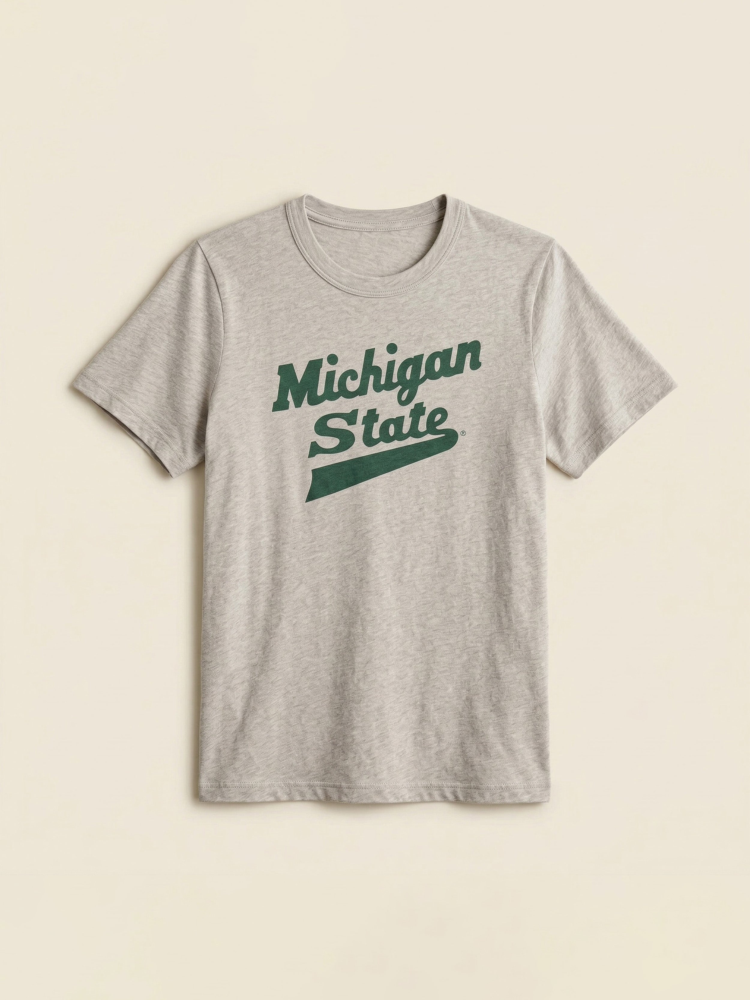 Gray t-shirt with Michigan State graphic logo on a beige background