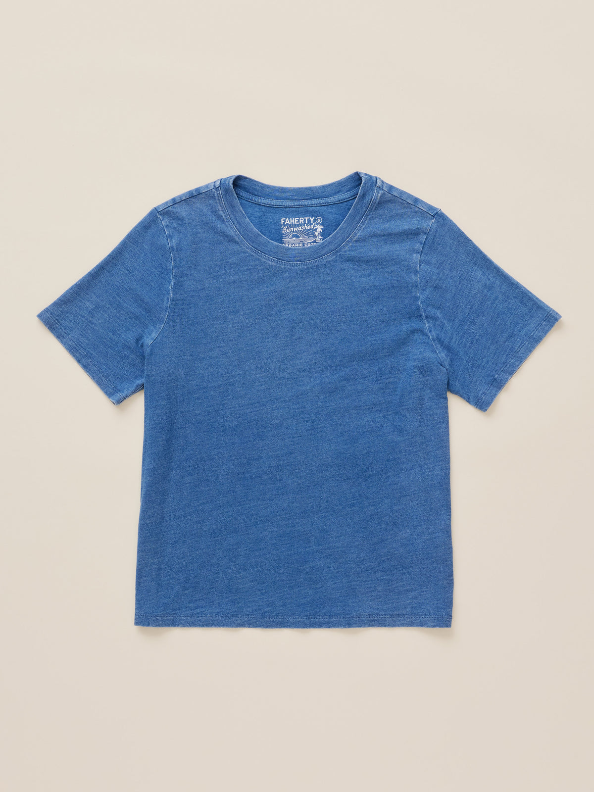 A short-sleeve crewneck t-shirt in a heathered medium blue color, laid flat against a solid light beige background. The brand name Faherty is visible on the inner neck label., image 7 of 8