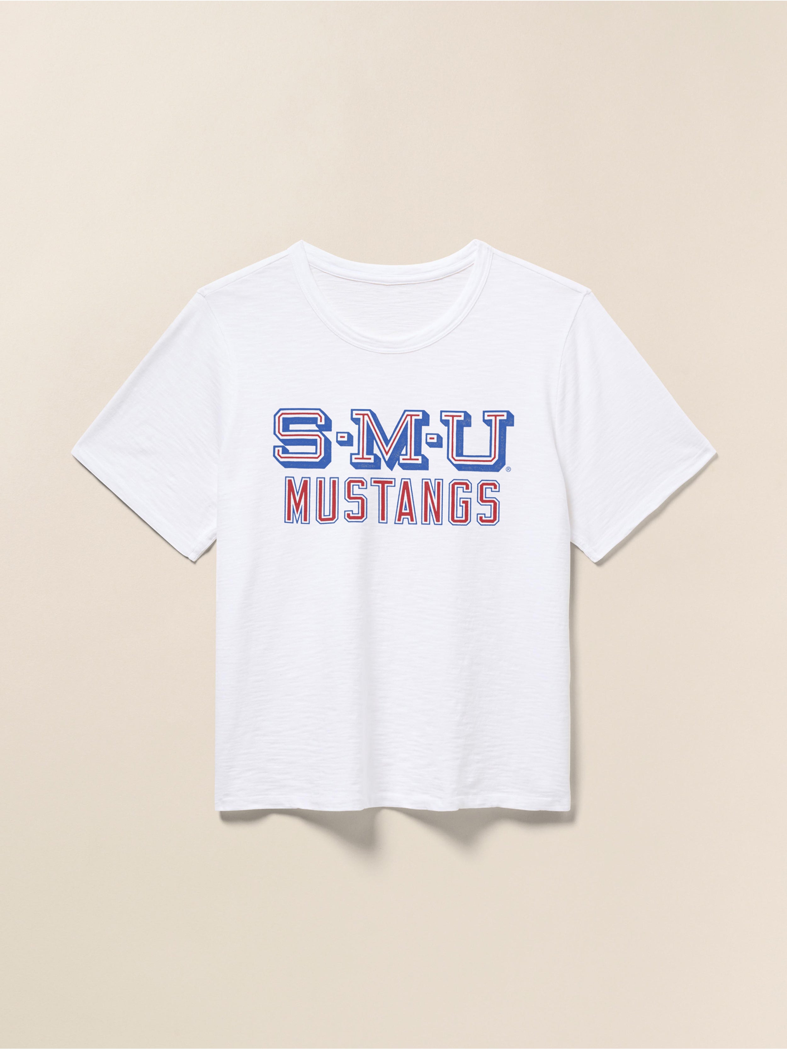 White t-shirt with SMU graphic on the chest against a beige background