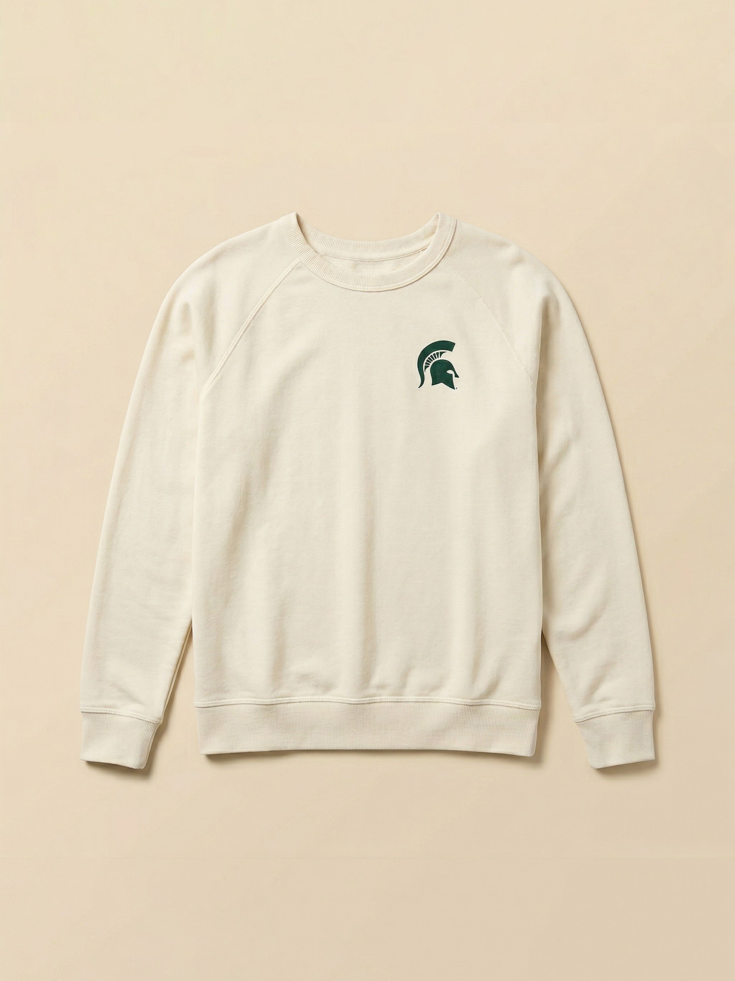 White sweatshirt with a Michigan State graphic logo on the left chest against a beige background
