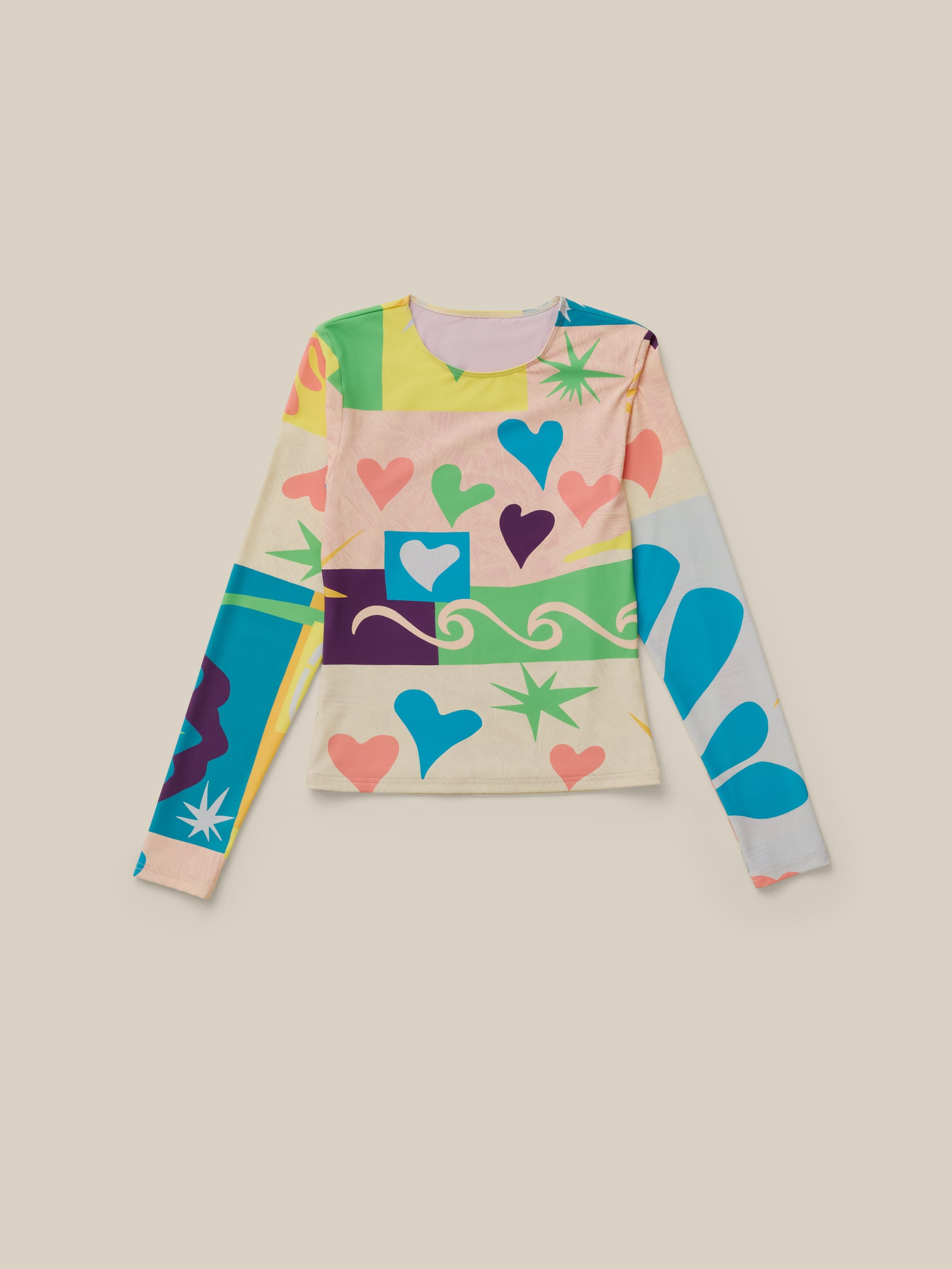Multicolor printed rashed guard on a beige background