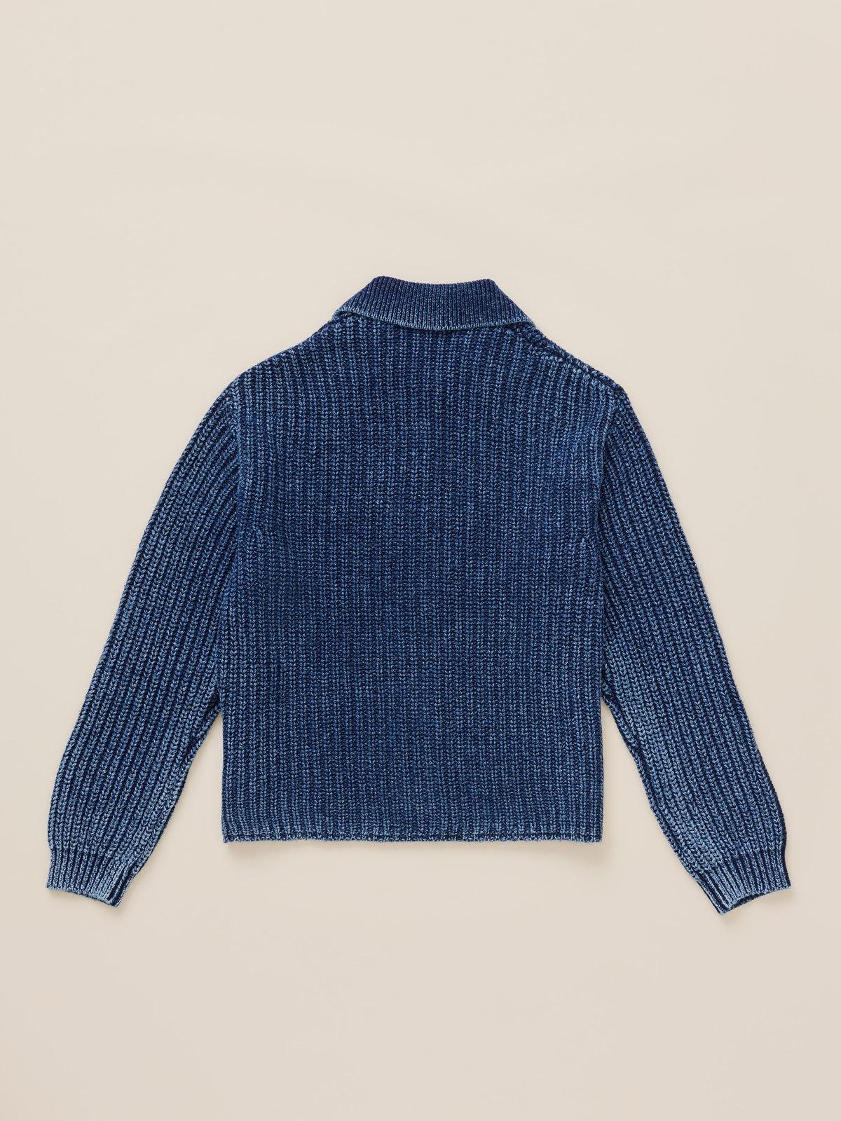 Blue cardigan viewed from the back against a warm beige studio background, image 8 of 8