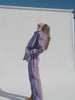 Video of a woman wearing a colorful striped suit against a beige background