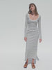 Video of a woman wearing a navy and white striped dress against a white background 