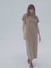 Video of a woman wearing a brown t-shirt dress against a white background