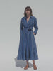 Video of a woman wearing an indigo striped wrap dress against a white background