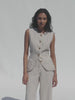 Video of a woman wearing a brown striped linen vest with matching pants